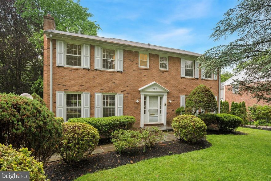 WELCOME TO 425 WISTER ROAD — A TIMELESS CENTER HALL COLONIAL NESTLED IN THE HEART OF ONE OF WYNNEWOOD'S MOST SOUGHT-AFTER NEIGHBORHOODS, PROUDLY LOCATED IN THE AWARD-WINNING LOWER MERION SCHOOL DISTRICT. Lovingly cared for by the same family for nearly 40 years, this gracious home is rich in character and full of potential, ready to welcome its next owners into a new era of cherished memories. Step into a warm and welcoming foyer, where a classic recessed staircase sets the tone for the elegance that unfolds within. To the left, a sun-drenched formal living room with a cozy fireplace offers the perfect retreat for quiet evenings or heartfelt gatherings.  Versatile family room with its covered porch presents boundless possibilities: a home office, music studio, playroom, or even a professional workspace. To the right of the foyer, the formal dining room flows seamlessly into a spacious eat-in kitchen, ideal for both everyday living and festive holiday entertaining. Upstairs, the second floor features a serene primary suite with ample closet space and a private en-suite bath. Five additional bedrooms and two full hall baths provide comfort and flexibility for family and guests alike. The lower level includes a laundry area, generous storage, workshop potential, and a bonus family room—making this home as functional as it is charming. Outside, enjoy a large backyard with mature gardens, a whole-house generator, and ample driveway parking. Whether you're hosting summer barbecues or enjoying a peaceful morning coffee, the outdoor space offers a tranquil escape. The location is truly unmatched. Just a short walk to both the Wynnewood and Ardmore SEPTA-Amtrax Stations, commuting to Center City or exploring the vibrant Main Line is effortless. Enjoy nearby favorites like Trader Joe’s, Whole Foods, Suburban Square, and the boutiques and eateries of downtown Narberth. Lower Merion High School and beloved community destinations like the Narberth playground are just moments away.
425 Wister is more than a house—it's a home where tradition meets opportunity, and where every detail invites a new beginning. DISCOVER A PLACE WHERE HISTORY, HEART, AND HOME COME TOGETHER — THIS IS THE ONE YOU’VE BEEN WAITING FOR.