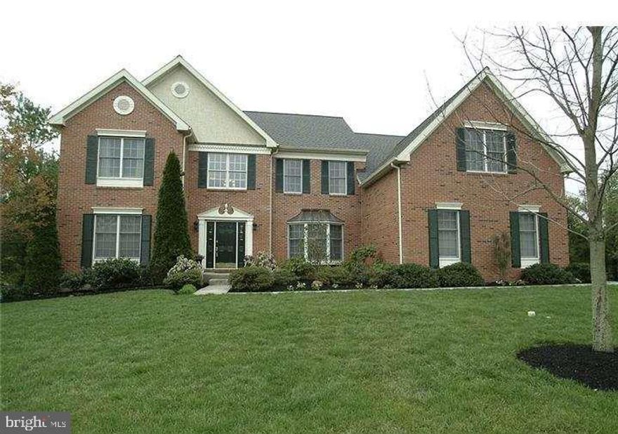 Located in the highly sought-after Greens at Waynesborough in the Tredyffrin-Easttown School District, this Toll Brothers–built 5 bedroom, 4 bath brick-front home offers a flexible, well-designed layout with recent updates on a landscaped corner lot along a quiet interior street. A bright two-story foyer with hardwood floors and detailed millwork opens to a floor plan that connects formal living and dining areas to an expansive family room, ideal for everyday living and entertaining. The kitchen features a center island with gas cooktop, granite countertops, stainless steel appliances, and abundant cabinetry, serving as a central hub of the home. A flexible first-floor office or bedroom with a full bath provides an ideal setup for guests, work-from-home, or multigenerational living. Upstairs, the primary suite includes a sitting area, multiple closets, and a private office or retreat space. One bedroom offers an en-suite bath, while two additional bedrooms share a Jack and Jill bathroom. New flooring throughout the second level and fresh interior paint enhance the home’s move-in-ready appeal. The finished lower level adds approximately 1,000 square feet of living space, including a media area, wet bar, and a separate room suitable for a bedroom, gym, or hobby space. Recent updates include a new HVAC system, new garage doors, updated fireplace, and new cooktop. A three-car garage with EV charger adds convenience, while the private yard with a large deck provides excellent outdoor living space. A neighborhood school bus stop is at the corner. Convenient access to nearby golf and tennis amenities and close proximity to Main Line hospitals. Ideally located close to major routes, shopping, and top-ranked schools, this is a rare opportunity in one of the Main Line’s most desirable communities.