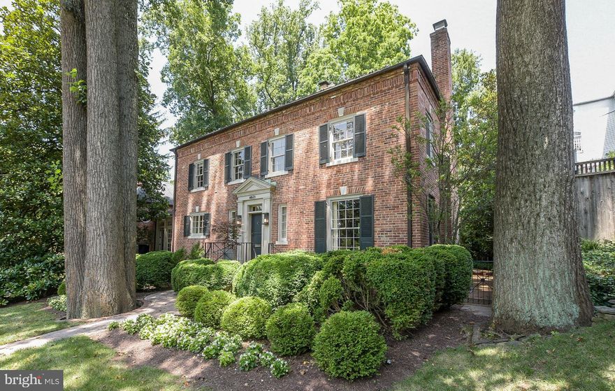 Stately brick Georgian sits on exceptionally large, private, maturely planted 13,400 square foot lot on premier street in Wesley Heights/Berkley and just a few short steps from Battery Kemble Park.The gracious interior is perfect for elegant entertaining with an expansive, light-filled first floor. Well-proportioned principal rooms have tall ceilings and custom details. Features include new kitchen/family room; step-down living room with fireplace; stylish dining room with fireplace; great room with built-ins and fireplace; garden room; indoor saltwater resistance pool; 4 bedrooms (all with en suite baths) 5.5 baths. A two car garage and large outdoor terrace complete this very special offering. Total livable square footage is 4550 sq ft according to floor plan drawings, or $526 per square foot!