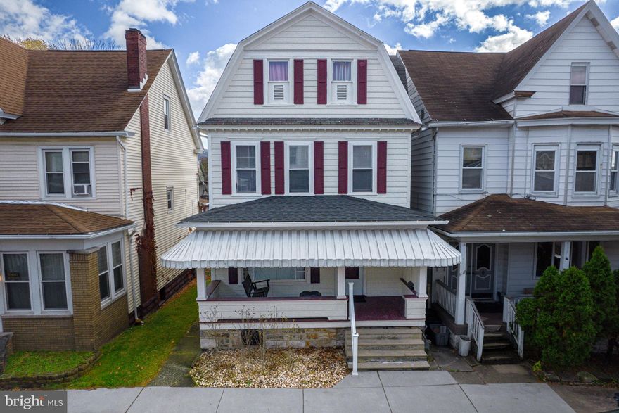 Do you have a growing family? Do you need several bedrooms? This large family home is just what you need. Recently updated, this home has all new paint, refinished original wood floors on the first floor, and an entirely new kitchen. A large living room, dining room and grand staircase, this home lends itself to 3 bedrooms and newly updated, full bath on the second floor. But it doesn't stop there! The third floor attic is a finished living space. While not heated the 3rd floor has wood floors and the windows let in plenty of light. These two large rooms can be used for just about anything. The finished basement has room for another living room or den complete with a wet bar and a full bath. A covered front porch with a swing and a large covered back patio for entertaining. A sizable fenced in yard for the kids and/or the pets to play and leads to a two car garage with alley access. Located in a nice neighborhood with many amenities close by.