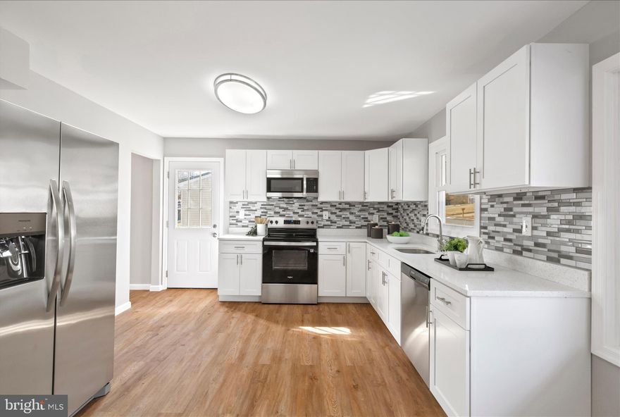 Come and see this gorgeous 2 Level Ranch  Style home with a fully finished basement. 4 Bedrooms and 2.5 Bathrooms.The updated interior showcases contemporary finishes and a thoughtful layout that maximizes both style and functionality. The custom kitchen with quartz countertops, and stainless-steel appliances offers maximum versatility and functionality. Complete with open floor plan and modern finishes that will wow you the minute you walk through the door. The bathroom has been tastefully refreshed adding modern elegance to this classic home. Freshly painted, new carpet and flooring throughout. Enjoy exciting times in the fenced backyard area, great for entertaining, grilling, and relaxing. Close to restaurants and shopping adding convenience to major routes,. Schedule to see this amazing home today!!