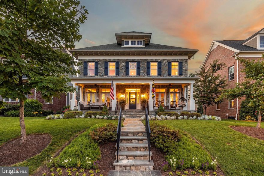 Nestled within picturesque Baker Park, this extraordinary home offers a rare and unparalleled opportunity. Situated on one of the most esteemed blocks in Downtown Frederick, it stands as a testament to exceptional design and timeless elegance. With over 6800 sf of beautifully appointed finished space, prepare to be captivated by a residence like no other. Every detail reflects exquisite craftsmanship by custom home builder, Mitchell and Best.  Upon entering, you are welcomed by soaring ceilings and abundant natural light that highlights the beautiful flooring and luxurious finishes throughout the thoughtfully designed home. The inviting covered front porch offers picturesque views of Baker Park, setting the stage for the grandeur within. The stately foyer perfectly introduces the home's extraordinary interiors. The dining room is warm and intimate with its sophisticated gold-painted ceiling and wall of French doors leading to the slate-covered front porch. A private office on the first floor with built-in bookcases provides an ideal space for working from home and opens to a front sitting room via pocket doors. At the heart of this home lies the gourmet kitchen and breakfast room, opening to a spacious, light-filled family room adorned with a hand-painted coffered ceiling and gas-burning fireplace. The kitchen is a culinary enthusiast's dream. It features custom cabinetry with stunning quartz and granite countertops, a grand 11' x 4.5' island, and top-of-the-line appliances, making it incomparable in design and functionality. The butler's pantry offers extra storage and prep space, perfect for hosting elaborate events. The upper level hosts a luxurious primary suite with a wall of windows that even the most discerning would desire. Dual walk-in closets, custom shelving, and a spa-like en-suite bathroom provide utility and luxury. Three generously sized bedrooms offer exceptional comfort, including a guest bedroom with its own en-suite bathroom. An additional hall bathroom and a well-appointed 2nd-floor laundry room provide functionality and convenience. The finished basement offers versatile living spaces, including an exercise room, recreational room, full bath, and a fifth bedroom. Direct access to the outside through a staircase leading to the rear fenced-in yard adds convenience for guests. Stepping outside, you're greeted by meticulous landscaping and a custom slate and composite deck, offering a private outdoor oasis for relaxation and entertainment. The property also includes a detached two-car garage with two Tesla level 2 chargers, ensuring secure parking, extra storage, and an opportunity for an additional dwelling unit.  You'll relish the peace of mind that comes with an exceptionally high energy efficiency rating (3.0 Energy Star Rating).  The home is outfitted with commercial-grade Wi-Fi throughout, extending even to the garage. Further enhancements include perimeter video security, a central alarm system, exterior speakers, a 22KW Generac generator with load shedders, water flow and leak sensors, smart thermostats, and intelligent Wi-Fi switches. Every aspect of this home has been meticulously designed and executed to provide an unrivaled living experience! Some furnishings are available for sale.