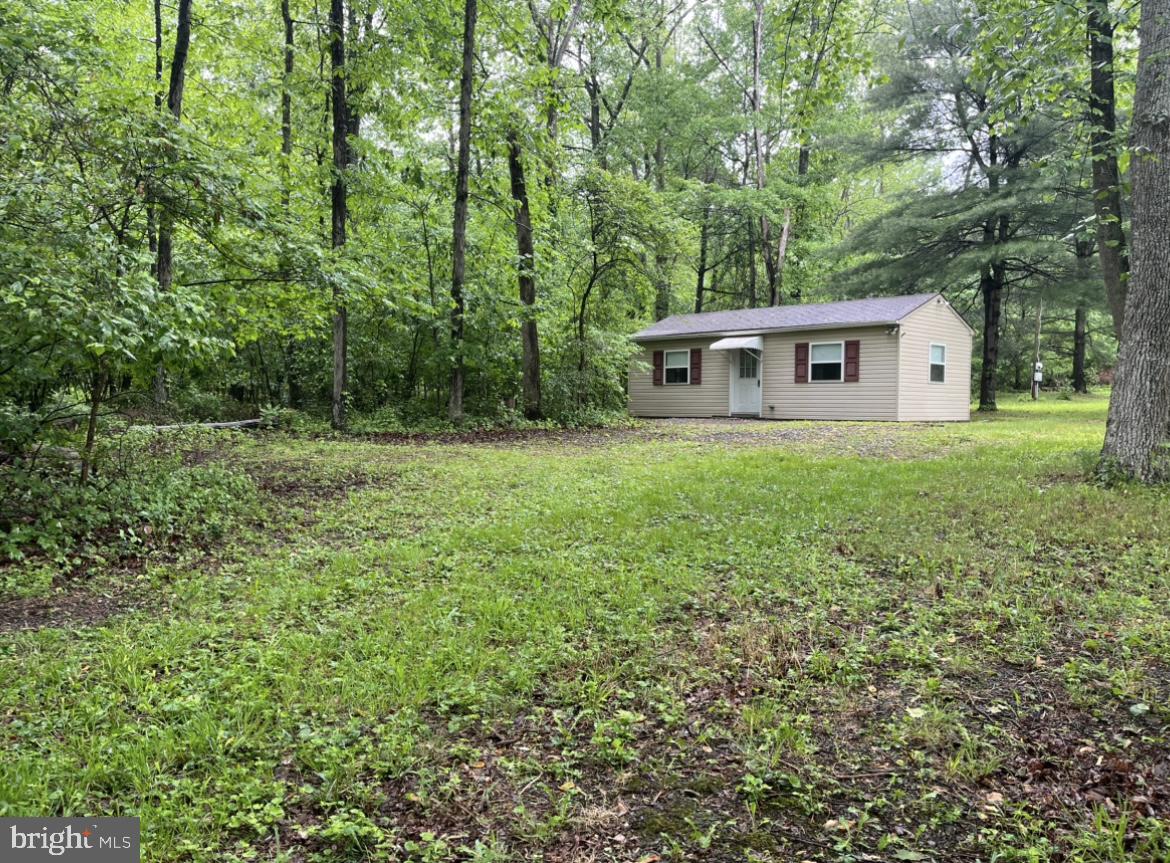 This cute cabin property could be just the stress reliever you need. Spend the day fishing McCabe Run and the evenings sitting by the fire. Plenty of secluded woodland for the kids to explore. The cabin features an open living/kitchen area and a bunk room. The wood stove conveys. Cabin has electric and there is a well on the property, but it needs a new pump. Septic is an outhouse.