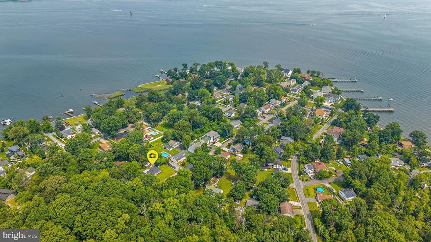 Peaceful Living by the Bay – Perfect for Downsizing!

Looking to simplify without sacrificing charm or location? This move-in ready 3-bedroom, 1-bath rancher is the ideal opportunity for anyone craving a slower pace, less maintenance, and more time to enjoy the good life.

Tucked on a quiet corner lot next to a protected nature reserve, this single-level home offers peace, privacy, and natural beauty—with low maintenance. Just a short walk to the bay front, you’ll love starting your mornings with coastal breezes and winding down with sunset walks to the community pier.

Inside, enjoy a warm and inviting open layout, complete with a cozy wood stove and a splash of personality from the bright red front door. Major updates—roof, HVAC, water softener, and well pump—all done within the last 3 years—mean you can move in and relax from day one.

The manageable yard has 2 sheds for extra storage and a roomy driveway (with space for a boat or guests), and surrounding greenery make outdoor living simple and serene. Plus, the neighboring nature reserve means no new development next door—ever.

If you’re ready to downsize to comfort, convenience, and coastal charm, this is the home for you.