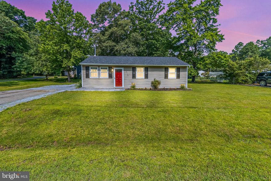 Peaceful Living by the Bay – Perfect for Downsizers!

Looking to simplify without sacrificing charm or location? This move-in ready 3-bedroom, 1-bath rancher is the ideal retreat for anyone craving a slower pace, less maintenance, and more time to enjoy the good life.

Tucked on a quiet corner lot next to a protected nature reserve, this single-level home offers peace, privacy, and natural beauty—with low maintenance. Just a short walk to the bay front, you’ll love starting your mornings with coastal breezes and winding down with sunset walks to the community pier.

Inside, enjoy a warm and inviting open layout, complete with a cozy wood stove and a splash of personality from the bright red front door. Major updates—roof, HVAC, water softener, and well pump—all done within the last 3 years—mean you can move in and relax from day one.

The manageable yard has 2 sheds for extra storage and a roomy driveway (with space for a boat or guests), and surrounding greenery make outdoor living simple and serene. Plus, the neighboring nature reserve means no new development next door—ever.

If you’re ready to downsize to comfort, convenience, and coastal charm, this is the home for you.