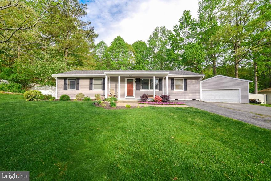 Welcome home to this wonderful rambler tucked at the very end of the street.  This lot backs to trees and is fully fenced.  Three bedrooms and 2 full baths plus an updated kitchen, huge living room and large laundry room. For those who enjoy tinkering, there is a large detached garage, currently used as a wood shop.  A welcoming front porch , and a large deck out back to enjoy the privacy.