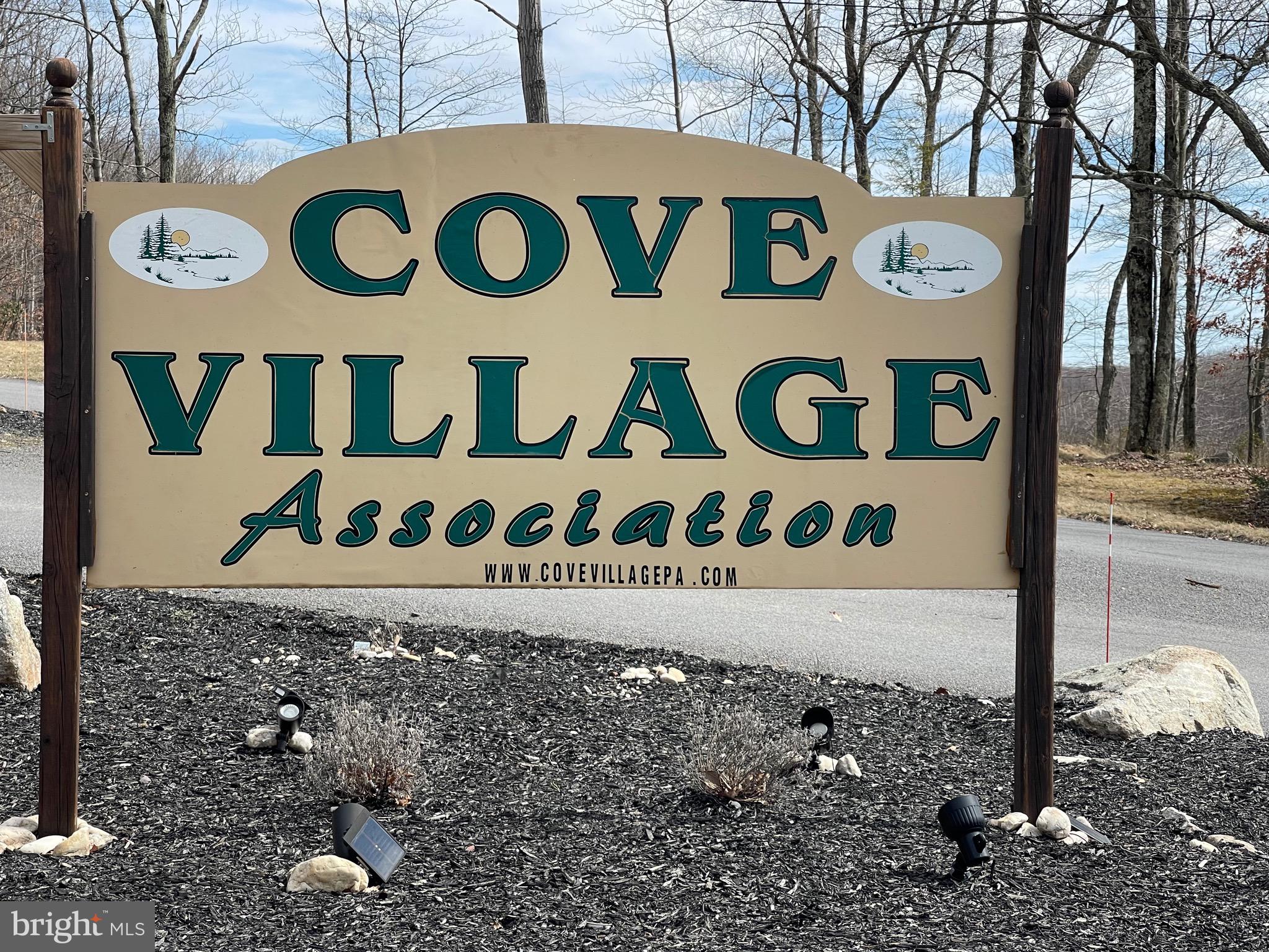Gorgeous level building lot on a low-traveled street. Tranquility best describes the feeling of this location! The Cove Village Community is situated in the foothills of the Poconos and only 1 1/2 hours to New York, With easy access to I-81 your commute to Hazleton, Wilkes Barre, or Scranton is a breeze. Bring your own builder and let's get started. Another cost-saving perc of the community is having public water and sewer already in place and ready for you to connect through Aqua of Pa. 750 acres of unoccupied prime hunting, ATV, and snowmobile riding land surround the residential portion of Cove Village and is allocated only for the residents of the community and their guests! Driving through the community, the peace and tranquility will envelop you. At any given moment the deer, turkey, and birds will entertain you in your own backyard. Homes within the community vary from rustic cabins and chalets to traditional ranch or two-story homes and even exquisite new construction or dreamy mountain log homes. There really is something for everyone. The approximately 278 acres of residential homes and lots are occupied by full-time residents, part-time vacation homes, and even some snowbird second homes. Cove Village offers an abundance of amenities including a swimming pool, stocked fishing lake, a basketball court, tennis courts, a volleyball court, 2 playgrounds, a baseball field, ATV paths, hunting, a mini golf course, walking paths, and year-round Community events. I can't forget to mention the beautiful lodge ideal to rent for family gatherings. This lot and community just might be exactly what you've been looking for. Air B and B are not permitted. Camping on vacant lots is not permitted. Mobile homes are not permitted. The minimum square footage when building is 1400 square feet. The community maintains the roads and snow removal. Trash collection is also provided. An appointment is required to view due to the gated community. Call to schedule your tour today!