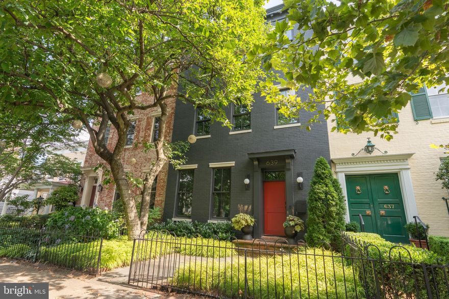 639 E Street SE is more than a home — it’s a statement of design and craftsmanship, offering 4,500 square feet across three beautifully finished levels.  At almost 23 foot wide and with a 100 foot deep lot - this one is special.  Totally rebuilt, only the front facade remains, by the outstanding team of Horizon/Alliance Builders and designed by Christian Zapatka, the residence features 4 bedrooms plus an office and 4.5 baths, with every bedroom offering both a walk-in closet and an ensuite bath.

Landscaped front gardens, architectural garden walls, and custom steel-and-mahogany gates create an elegant introduction. Inside, wide-plank rift- and quarter-sawn white oak floors lead through sun-filled spaces finished with meticulous detail. The great room showcases heated floors and custom Kolbe bifold doors spanning the rear façade, opening to a private terrace framed by mature Ginkgo trees and creating seamless indoor–outdoor living.

At the heart of the home is its celebrated and award-winning Snaidero kitchen, pairing Italian cabinetry with a dramatic waterfall island and professional-grade Sub-Zero, Wolf, and Miele appliances. Stone backsplashes, floating shelving, integrated lighting, and carefully selected hardware highlight the pursuit of perfection.

The primary suite offers a serene retreat with a luxurious bath featuring a Victoria & Albert soaking tub, Waterworks rain shower, honed stone finishes, and Lutron-controlled shades. Secondary suites continue the elevated palette with thoughtfully designed tile and high-end fixtures.

Thoughtful design extends throughout the home — from custom library shelving and built-in reading spaces to a beautifully outfitted laundry room and multiple areas for relaxation and entertaining. Outdoor living includes a bluestone terrace, drought-tolerant landscaping, and a rear terrace that can double as private parking.

All of this is set in one of Capitol Hill’s most desirable locations, just a block from Eastern Market and Barracks Row,  and a short stroll to the U.S. Capitol, Supreme Court, Lincoln Park, the Navy Yard waterfront, shops, restaurants, parks, and Metro, with easy access to I-695 and downtown.
