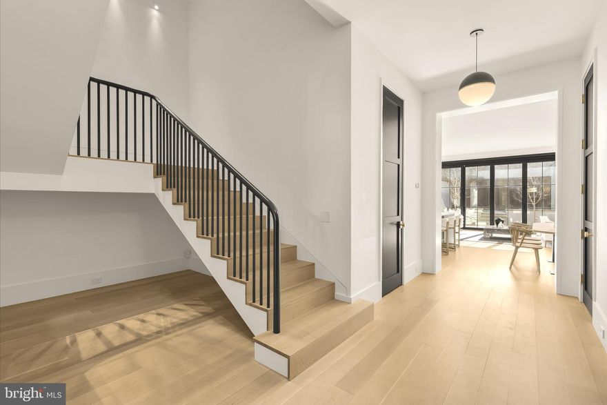 639 E Street SE is more than a home — it’s a statement of design and craftsmanship, offering 4,500 square feet across three beautifully finished levels.  At almost 23 foot wide and with a 100 foot deep lot - this one is special.  Totally rebuilt, only the front facade remains, by the outstanding team of Horizon/Alliance Builders and designed by Christian Zapatka, the residence features 4 bedrooms plus an office and 4.5 baths, with every bedroom offering both a walk-in closet and an ensuite bath.

Landscaped front gardens, architectural garden walls, and custom steel-and-mahogany gates create an elegant introduction. Inside, wide-plank rift- and quarter-sawn white oak floors lead through sun-filled spaces finished with meticulous detail. The great room showcases heated floors and custom Kolbe bifold doors spanning the rear façade, opening to a private terrace framed by mature Ginkgo trees and creating seamless indoor–outdoor living.

At the heart of the home is its celebrated and award-winning Snaidero kitchen, pairing Italian cabinetry with a dramatic waterfall island and professional-grade Sub-Zero, Wolf, and Miele appliances. Stone backsplashes, floating shelving, integrated lighting, and carefully selected hardware highlight the pursuit of perfection.

The primary suite offers a serene retreat with a luxurious bath featuring a Victoria & Albert soaking tub, Waterworks rain shower, honed stone finishes, and Lutron-controlled shades. Secondary suites continue the elevated palette with thoughtfully designed tile and high-end fixtures.

Thoughtful design extends throughout the home — from custom library shelving and built-in reading spaces to a beautifully outfitted laundry room and multiple areas for relaxation and entertaining. Outdoor living includes a bluestone terrace, drought-tolerant landscaping, and a rear terrace that can double as private parking.

All of this is set in one of Capitol Hill’s most desirable locations, just a block from Eastern Market and Barracks Row,  and a short stroll to the U.S. Capitol, Supreme Court, Lincoln Park, the Navy Yard waterfront, shops, restaurants, parks, and Metro, with easy access to I-695 and downtown.