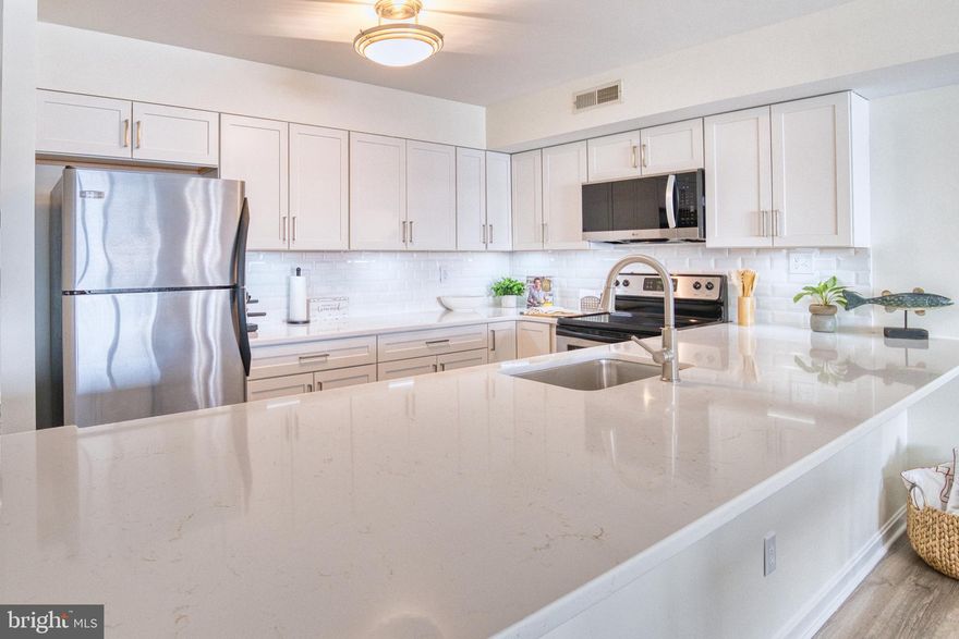 Open House Saturday May16th from 10:00 - 12:00. Fully Remodeled Chester River Waterfront Condo!  This gem won't last long! Beautifully renovated 2BR/2.5BA waterfront condominium located in the sought-after Queen’s Landing resort-style community on the scenic Chester River, just off the Chesapeake Bay. This move-in-ready home showcases a stunning top-to-bottom remodel, including new luxury vinyl plank flooring, new carpet, fresh paint throughout (ceilings, walls, trim, and doors), new white cabinetry, beautiful quartz countertops with beveled white backsplash, updated bathroom vanities, flooring and modern lighting fixtures. The light-filled open floor plan is designed to highlight the panoramic Chester River views. The spacious family room off the kitchen features an oversized sliding glass door leading to a private balcony with beautiful eastern water views—perfect for morning coffee or relaxing evenings overlooking the river. Upstairs, the primary bedroom suite offers elevated water views and a private full bath. A second large bedroom and additional full bath complete the upper level, with washer and dryer conveniently located between the bedrooms. Residents of Queen’s Landing enjoy exceptional waterfront amenities including a private marina, swimming pool overlooking the Chester River, clubhouse, fitness center, tennis and pickleball courts, and scenic waterfront walking paths. Ideally located just minutes from shopping, dining, entertainment, the Cross Island Trail, and the Chesapeake Bay Bridge, this home is perfect as a full-time residence or weekend waterfront retreat on Maryland’s Eastern Shore. Professional video will be uploaded later today.  Schedule your private tour today!