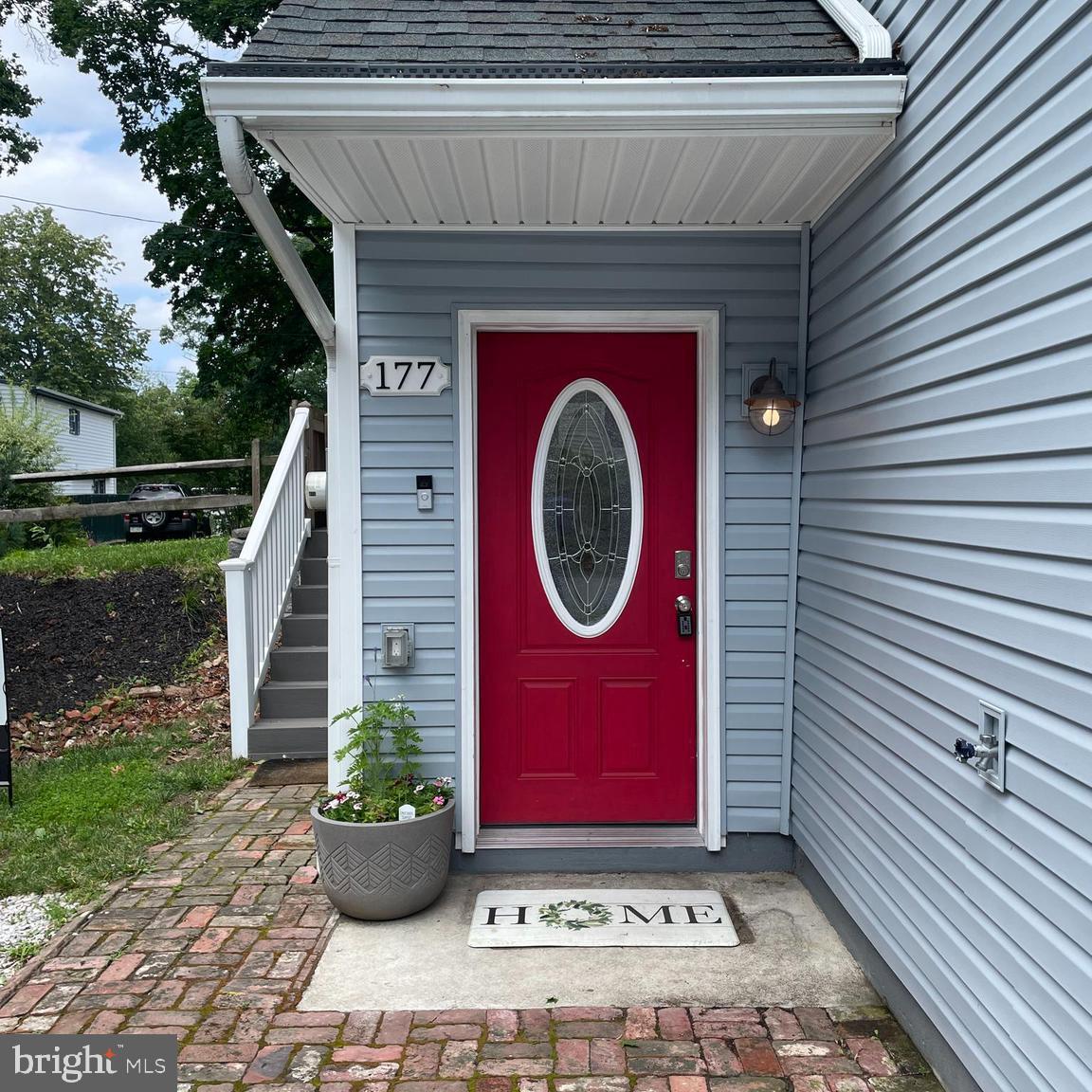 Welcome to 177 Bortondale Road—a beautifully updated corner property, built in 2020, offering the perfect blend of modern comfort and thoughtful design. This 3-bedroom, 3.5-bathroom home has rich hardwood flooring through the main living level and the 2nd floor hallway into all three bedrooms. The open floor plan on the main floor features a soaring vaulted ceiling in the family room, large windows that fill the space with natural light, and an easy flow into the spacious kitchen and dining area. The kitchen with white cabinetry, stainless appliances, granite countertops, a beverage refrigerator and a pantry closet is open to the light filled dining area. adjacent is a versatile bonus space—ideal for a home office with its built-in desk. Completing this level are the convenient half bath and a laundry room with cabinetry. Step out from the kitchen onto a covered porch with a few steps down to a brick patio and a private, fenced-in yard, perfect for outdoor entertaining. From the main level, take the turned staircase up to the primary suite that offers a peaceful retreat with recessed lighting, a ceiling fan, hardwood flooring, and two custom walk-in closets. The ensuite bath features a double sink vanity with Carrera top, a shower/tub combo, and linen closet. Two additional bedrooms, each with hardwood floors and ceiling fans, share a full hall bathroom on this level.
The lower level with entry from the parking area provides incredible flexibility with a coat closet, full bathroom, a large recreation room, a bonus room that can function as an office or additional bedroom with a closet, plus a dedicated storage room with utilities.
Ideally located just minutes from the Moylan-Rose Valley train station and charming downtown Media with its many shops and restaurants, this home offers easy access to major routes into Philadelphia and Wilmington.