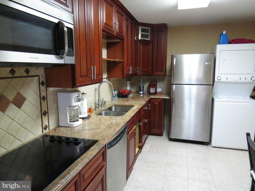 Gleaming Hardwood Floors, Granite Counters and Cherry Cabinets. Garage parking included. Open and Spacious 1309 sq ft. Serene, park-like setting/view from 13 foot balcony. Resort Style living on 36 Gated acres. All Utilities included in rent. Indoor/Outdoor Pools & Tennis, Sauna, Gym, Restaurant/Conv Store and shuttle to Metro