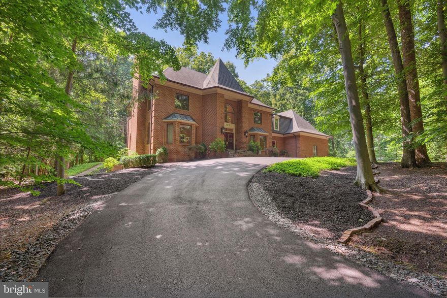 *** This stunningly renovated home offers a distinctive lifestyle with its distinctive features and attention to details. Elegantly sited on 2.4+ acres with 4 finished levels, this home has been completely renovated with exceptional design and craftsmanship. In 2014, BOWA renovated the owner's suite to add new features such as a steam shower, walk-in closets for both him and her, separate water closets, a laundry room, a sitting room, heated floors, travertine tiles and expanded living space with hardwood floors. In 2018, the kitchen underwent renovations that included the addition of Wolf and Subzero appliances, an ice maker, wine coolers, and new, stylish Omega cabinetry. Additionally, the entire house is equipped with a 45 KVa Kohler generator. In 2019, the basement was remodeled and now features heated tiled floors, two fully updated bathrooms, and two extra rooms that can be used as an office or exercise space. This home features four fireplaces, two of which have been converted to gas for a cozy and inviting atmosphere while entertaining. The main level boasts an elegant living room and a formal dining area - perfect for hosting extravagant dinner parties. The kitchen which overlooks the backyard has generous counter and storage spaces. The adjoining family room is the perfect place to unwind and relax with family and friends.  It features a high ceiling, a cozy fireplace and large windows that allow natural light to come in with a new exquisite wet bar. Three additional spacious bedrooms and two full baths offer comfortable living for family and guests. The 4th level offers a walk-in closet and a full bath that’s perfect for kids’ playroom, sleepovers or quiet reading time. The walk-out lower level is an entertainer's delight, with a large recreation room with cove lighting, wood burning fireplace and wet bar. The main level offers a mudroom with a laundry facility, wine fridge, full size refrigerator and dishwasher. The sweeping backyard is an oasis of tranquility, with lush landscaping, and two patio areas perfect for al fresco dining. The newly Trex deck off the family and kitchen was installed in 2019 and is a perfect way to unwind while enjoying nature. This home is further enhanced with a newly repaved circular driveway and a three-car garage. The main entrance steps and driveway have a heated snow melt system and there are security cameras throughout the exterior of the home. This home also offers a 3-zone newer HVAC system. The utility room and garage spaces have been updated with lots of storage shelving. With easy access to major commuter routes, shopping, dining, and entertainment options, this is the perfect place to call home. For anyone seeking a luxurious abode in Great Falls, this property is an opportunity not to be missed. It's clear that meticulous planning and design have gone into creating this incredible residence, making it a true gem in the real estate market. 5 minute drive to River Bend Golf & Country Club, a short walk to Potomac River and L'Auberge Chez Francois! Click on 3D Virtual Tour.
