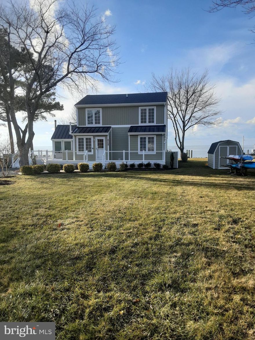 Here's your chance to not only live on Tilghman Island, but also live right on the Chesapeake Bay.  Watch the ships and boats work and travel the bay. Wonderful sunsets from your living room and waterfront deck. Dock  your boat at your front door for easy access to all the Bay offers. The house offers 3 bedrooms and 2 full baths. The primary bedroom is located on the main floor. The other two bedrooms are upstairs and share a full bath. On the main floor you will find an open living area with a propane fireplace, primary bedroom, full bath and kitchen. Kitchen has granite and new Whirlpool stainless appliances, The stove is propane. Sliding glass doors bring the outside in for wonderful views of the dock and bay. There is also a four season room that is a wonderful sitting room and includes a wood stove for those chilly evenings. It also adds additional  living space that is not included in the public record of the square footage of the house. Sellers have replaced all the outside decking, HVAC, kitchen appliances, roof and siding over the last few years. This property was licensed as a short term rental last year