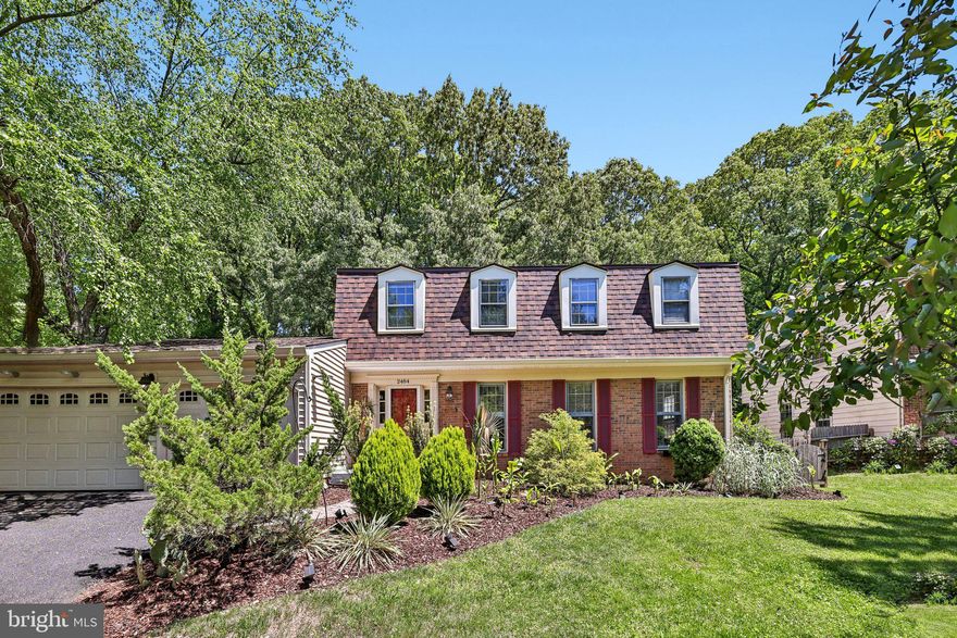 Beautifully updated single family home that greets you with warmth and charm. The foyer features luxury vinyl plank flooring and crown molding, leading into a bright formal living room filled with natural light. The dining room offers a bay window and a custom built-in quartz counter with a beverage refrigerator—perfect for entertaining.<p>

<p>The renovated eat-in kitchen shines with white cabinetry, quartz countertops, a custom tile backsplash, stainless steel appliances, a built-in island, and a pantry. A side-by-side washer and dryer add everyday convenience. The inviting family room features a wood-beamed ceiling, stacked-stone wood-burning fireplace, and built-in bookcases. Sliding doors open to a two-level brick patio and spacious fenced yard, ideal for relaxing or entertaining.<p>

<p>Upstairs, the primary suite includes a walk-in closet, window seats with hidden storage, and a beautifully renovated bath with dual sinks and a custom-tiled shower. Three additional bedrooms and an updated hall bath provide plenty of space. The lower level offers a large recreation room, a flexible bonus room for guests or a home office, a full bath, and ample storage.<p>

<p>Recent updates include new flooring, fresh paint, a renovated kitchen with new appliances, and major exterior improvements such as a new roof, siding, gutters, and PVC trim, plus a newer AC unit. With thoughtful updates and great indoor-outdoor living, this home is truly a must-see!