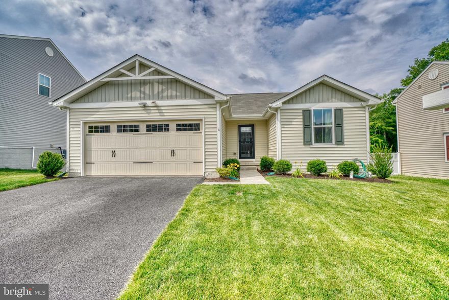 This nearly new, custom-built rancher offers a contemporary twist on a traditional style. The expansive first level hosts an inviting entryway that ushers you into a large great room; complete with a living & dining area, and a kitchen with rich dark cabinetry, center island and stainless steel appliances, all anchored by newly installed LVP flooring. Two bedrooms and a shared hall bath are located in the front of the home and the primary ensuite with a large walk-in closet  is tucked nicely toward the back. Enjoy summer evenings on  your composite deck that overlooks a fully fenced sizable yard. The lower level is partially finished and plays host to a large 4th bedroom and a full bath. The unfinished portion is whatever you can imagine it to be; perfect for game nights, a big screen, game days, your Peloton — shall I go on?  Don't delay seeing this home, lovingly cared for and ready for you!