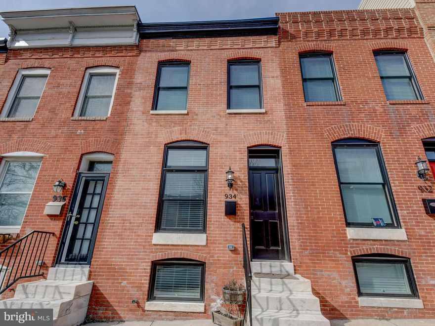 Take full advantage of city living in this stunning 4 Bedroom, 3 Bathroom Building Character CHAP Renovation in Canton!  House boasts hardwood floors, recessed lighting, ceiling fans, exposed brick with recessed nook in the Living room, and an audio system throughout.  Enjoy cooking in this stunning Gourmet kitchen with granite countertops, upgraded cabinets with large drawers and huge island containing additional cabinets, built-in microwave and wine refrigerator. Second floor has 2 Bedrooms and 2 Bathrooms including en-suite Master with oversized Bathroom and walk-in closet.  Lower level has 2 Bedrooms and Full Bath plus extra storage space and smaller storage room or tiny office with a glass door.  All bedrooms have recessed lighting and ceiling fans.  Upgraded bathrooms boast dual shower heads and gorgeous glass shower doors.  Take in the Baltimore skyline from the large rooftop deck and wide parking pad!!  8+ years left on CHAP!!