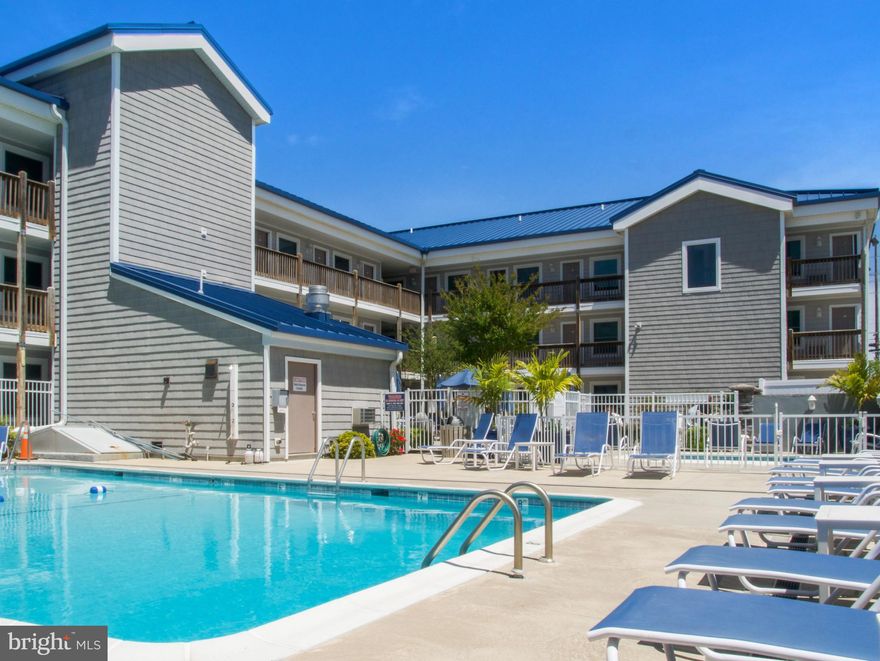 Welcome to the Ocean City, MD!
This gorgeous, turn-key uptown gem is the perfect investment property or vacation home! The well maintained and managed condominium building “Orleans Court” offers a beautiful gated courtyard featuring an outdoor pool and kiddie pool. The building also has an elevator but you won’t need it, as unit 117 sits conveniently on the first floor and the front door opens up to the courtyard and picnic area. The interior of the unit has been completely renovated with new quartz countertops and luxury ceramic tile flooring throughout the condo, including the spacious bedroom and bathroom. Off the bedroom you find a cozy private back porch with seating and storage. All of this and it’s only steps to the beach, many popular restaurants, mini golf and shopping! The rental income for 2022 was 24k! Schedule a showing today!