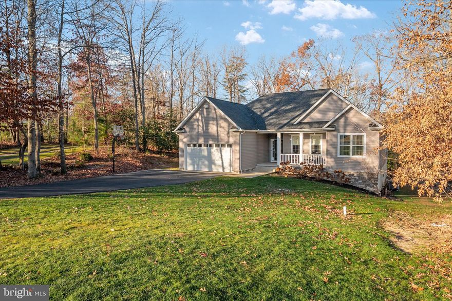 Clean as a whistle! Discover comfort, privacy, and flexibility in this beautifully maintained home, ideally situated at the end of a cul-de-sac. The property offers a serene setting while also providing practical features, including a main level primary suite, RV parking with a dedicated 20-amp outlet—perfect for recreational vehicles, boats, or additional parking needs. Inside, the open-concept layout connects the kitchen, breakfast nook, and living room, creating a welcoming space for everyday living and entertaining. Nine-foot ceilings and hardwood floors enhance the main level, while the kitchen features a walk-in pantry and ample workspace. A separate main-level laundry room adds everyday convenience. The spacious main level primary suite includes a walk-in closet and a private ensuite bath with a soaking tub, separate shower, and dual vanities. Two additional well-sized bedrooms and a full hall bath complete the main level. The fully finished walkout basement expands the home’s versatility with a large recreation room, an additional bedroom, and a full bathroom—ideal for guests, hobbies, or extended living space. Walkout access leads directly to the rear patio, offering an easy transition to outdoor living. An oversized garage provides abundant room for storage, tools, and recreational equipment. Located in a community with no HOA (covenants apply), this property offers flexibility of one level living while maintaining a charming neighborhood atmosphere. Commuters will appreciate the convenient access, with approximately 30 minute drives to JBA Joint Base Andrews, about 45 minutes to Annapolis or NAS Patuxent River, and roughly one hour to Washington DC and Northern Virginia. Offering a thoughtful layout, hardwood floors on the main level, and exceptional functionality, this is a rare opportunity in a peaceful yet accessible location. Schedule your private showing today.