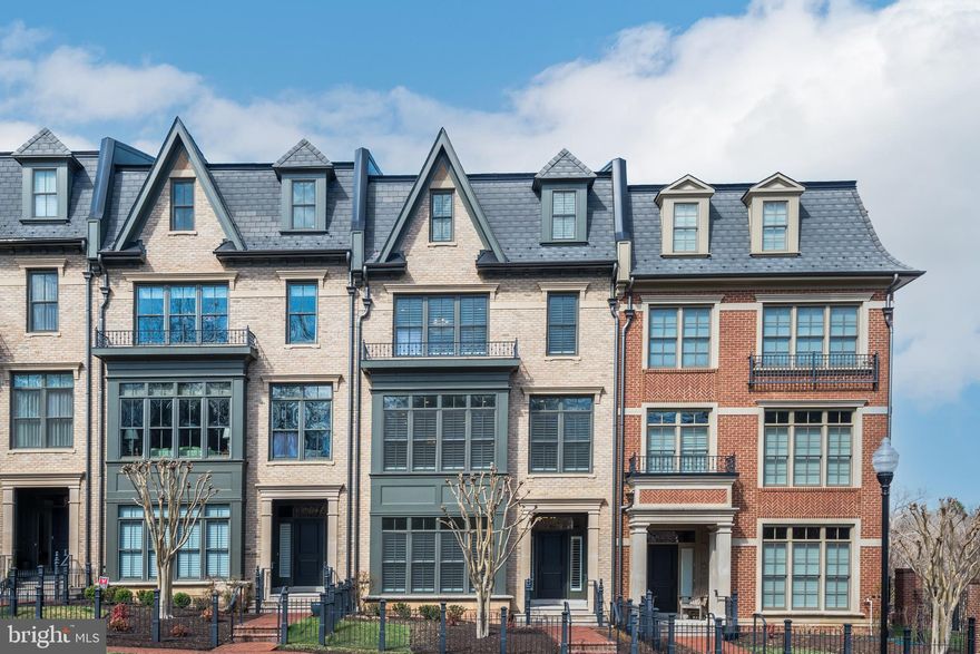 Step inside this stunning townhome, built by Michael Harris Homes, located in the highly desirable neighborhood of Symphony Park, adjacent to the Strathmore Music Center. This particular home is situated on the final/end-row of the subdivision, offering a more private and appealing setting with beautiful views of trees and greenery.

As you enter, you'll be greeted by exceptional craftsmanship and high-quality materials throughout, featuring a bright and airy floor plan that encompasses plenty of luxurious living space. The main level features a spacious foyer, a bedroom or office with custom built-in cabinetry, a bonus room or flex space, and a full bathroom. Notably, recessed lighting and tiered crown molding are found throughout the property. The hickory hardwood floors found throughout the property enhance its elegance, distinguishing it from other units that were typically built with carpeted bedrooms and secondary spaces.

Also on this level is access to the 2-car garage, equipped with a chair lift, and a large driveway that accommodates four vehicles—a significant advantage, as most units have a two-car driveway. If you'd prefer to avoid the stairs, the home features an elevator that services all four floors.

On the second floor, you'll find a massive living room, a gourmet chef's kitchen equipped with top-of-the-line appliances, a family room with a gas fireplace, a built-in eat-in area, a powder room, a pantry, and access to an extensive deck (complete with a gas connection for grilling). The kitchen is notable for its beautiful, painted Brookhaven cabinetry that extends to the ceiling, under-cabinet lighting, a grand central island with a marble top, and stainless steel Viking appliances. Additionally, custom plantation shutters adorn almost every window and door, allowing for privacy or an abundance of natural light. The ultra-high ceilings on each floor contribute to the home's overall brightness and lightness.

As you proceed to the third floor, you'll discover another bedroom with an en-suite full bathroom and a walk-in closet, a laundry room, and a luxurious primary suite featuring two walk-in closets (complete with custom built-ins) and a spa-like bathroom equipped with a soaking tub, fully tiled walk-in shower, and two separate vanities.

The final floor boasts a recreation room with vaulted ceilings, a wet bar with a beverage cooler, a bedroom with an en-suite full bathroom, and a gas fireplace that serves both the recreation room and the rooftop deck. The current owner has meticulously cared for this gem, adding numerous upgrades, including extra cabinetry in the kitchen, built-in dining benches, double doors for the main-level office, and custom-built bookshelves with cabinets, all crafted to the highest standards.

This home is not just a residence; it embodies a luxurious lifestyle. Don’t overlook the fantastic location, which offers breathtaking views of the wooded Strathmore Music Center and is just minutes from I-495 and I-270, as well as Bethesda, North Bethesda, and Rockville. These nearby areas offer a wealth of shopping options, restaurants, grocery stores, recreational activities, parks, trails, and more. Don't miss your chance to own the best value on the market—this opportunity won’t last long!