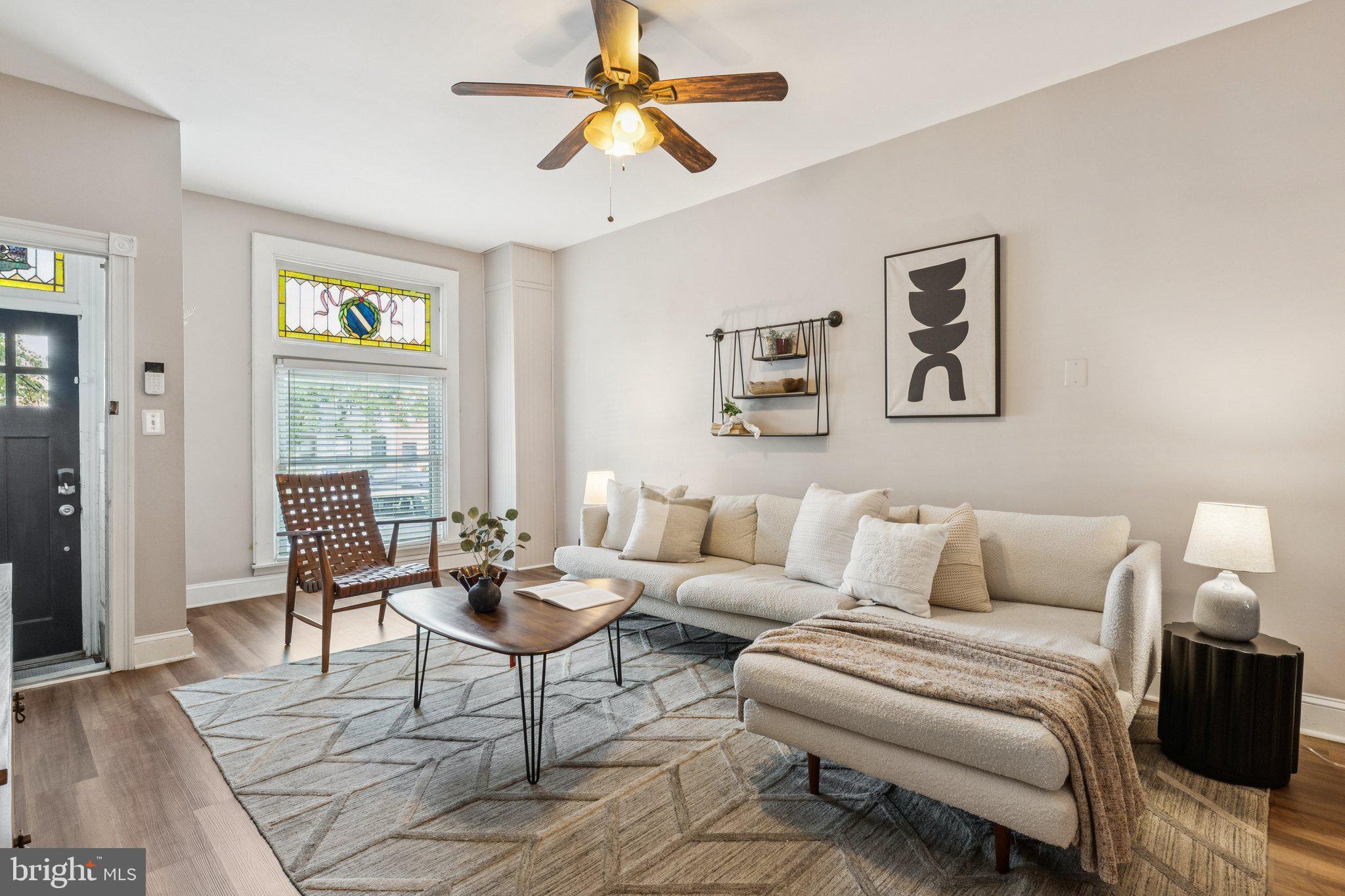 This captivating rowhome presents a fantastic prospect for those seeking a comfortable and stylish living space. Boasting 4 bedrooms and 2.5 bathrooms. Convenience is at your fingertips as this property is ideally located near a plethora of dining options, trendy shops, and excellent transportation connections. Indulge in the culinary delights of local restaurants, explore charming boutiques, and enjoy effortless commuting to work or leisure activities. Step inside and discover the inviting main level, complete with a cozy living room, a delightful dining area, and a modern kitchen that has been thoughtfully updated. The kitchen showcases sleek stainless steel appliances, elegant shaker style cabinets, and stunning granite countertops. This culinary haven provides the perfect setting to whip up delicious meals and entertain guests. Additionally, a powder room on the main level adds an extra layer of convenience for you and your visitors. The lower level basement offers a versatile space, ideal for hosting gatherings and creating lasting memories. Whether you're planning a movie night, game day extravaganza, or simply need a retreat to relax, this basement is sure to accommodate all your needs. To further enhance your experience, a charming rear deck awaits, offering an enchanting outdoor space where you can bask in the sunlight and unwind after a long day. Furthermore, a dedicated parking pad ensures that your vehicle is easily accessible at all times.