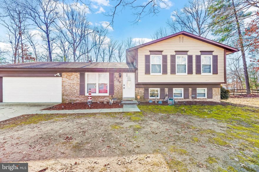 Welcome to your new home! This split foyer has everything you would need. Walking into the home, you will notice all the crown molding that was put in within the last 5 years, along with an open dining room- that could be used as a living room as well. The dining room/kitchen has vinyl wood flooring, that you walk across to the kitchen that was updated with new cabinets, Stainless Steel appliances towards the end of 2017, beginning of 2018, and granite counter tops.  The sliding door in the kitchen will lead you to the huge fenced back yard, that has a patio, hot tub, and a 10x12 storage shed.  Coming back inside you can choose to go downstairs for the current living room that has been freshly painted along with new LVP flooring. In here you can relax, have the wood fireplace going, or whatever you would like- you could even convert it to a game room with enough space for a pool table! Downstairs there is a bathroom that updated when the kitchen was, with porcelain tile, that host a walk in shower and the washer and dryer.  It's connected to the downstairs bedroom. Going back upstairs, to the upper level that is carpeted, you will have the additional three bedrooms that include the primary bedroom and the other bathroom. The primary bedroom is huge (currently furnished with a king bed and several other items) with two closets that connect to the bathroom. The two other bedrooms were just painted and have tons of room as well!  On the other side of the home is a huge 2 car garage that has so much room!! Make sure to scheduled your tour today, or stop by the Open House Friday Feb. 10th from 11am-130pm!
