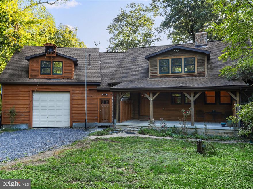 Cacapon Riverfront Retreat!!! 2.7 Acres on this very scenic river, facing spectacular limestone cliffs. This deep section of the waterway has some of the best swimming and fishing in the area.  The larger lodge style home sits outside of the flood zone but within view of the sparkling flow.  A gentle grade leads through the open woodlands to the  picnic area and waters edge.  Cedar siding adorns this diamond in the ruff with the natural wood beams and solid wood trims giving it the rustic charm you desire. 5 Bedrooms and 4 full baths making plenty of room for Family and Friends. 2 car attached garage.