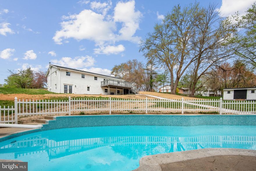 Welcome to this beautifully remodeled four-bedroom, three full bath contemporary style home in the heart Highland with one of the best schools in MD. The location is perfect - close to local highways  The top-to-bottom remodel makes this home feel both cozy and luxurious. The entire main level of the home boasts stunning hardwood flooring and recessed lighting all throughout. The living room is flooded with natural light and flows into the dining room viewing the kitchen with a stunning open island with granite counters with fully extended tile, custom cabinetry, stainless appliances, a five-burner stove with microwave, and much more. Walk out of the family room on a deck down to the  backyard extending 1 acre to the back with a beautifully newly fenced newly redone pool. The top-level primary bedroom features a modern full bath and bright windows. The other two bedrooms offer ample closet space and lighting as well. The lower level features a large multipurpose living room, bedroom with large closet, a bar, and full bath. Property features mostly new windows, new roof, new heat pump, new water,  all new flooring, new interior , new driveway, and exterior doors! A must see!