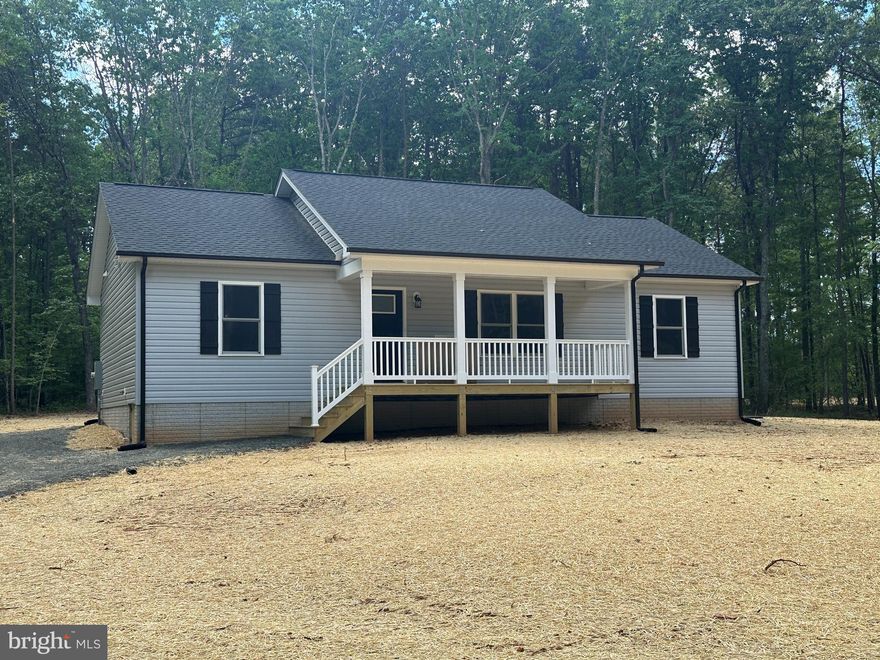 Beautiful Rambler Tucked Away on 2 Acres - Just Completed and ready for you! Open floor plan with vaulted ceiling in the Kitchen/Dining/Great Room area of the home. Rich LVP flooring throughout the entire home. Kitchen displays a large granite center island, gleaming white cabinetry, stainless steel appliances and double sink. Primary Suite complete with walk-in closet and Full Bath with double vanity. Two additional spacious Bedrooms balance out the opposite end of the home. Both Baths offer granite countertops and tub/shower combos. Thoughtfully designed Utility Room offers pantry, coat/storage closet and ample room for a full-sized washer and dryer. Sit for a bit on the covered front porch, adorned with metal pickets and easy to maintain vinyl railings. Relax on the rear deck or invite your friends/family for a backyard BBQ - plenty of space to enjoy! The black gutters/downspouts, shutters and door really make this charming home pop!!