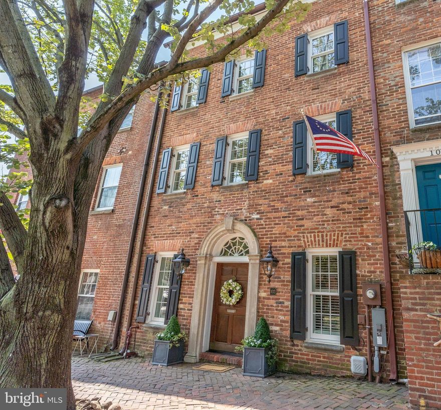 It is no surprise this spectacular Captain’s Row residence has been featured in Southern Living magazine. If you are looking for a unique, fully renovated home in the heart of Old Town, look no further!  Entering the residence from the most recognized cobblestone street, a solid carved mahogany door welcomes you into a brick foyer, versatile living/entertainment space, and features a direct view into the enchanted garden. French doors lead to a covered porch and one of the most breathtaking open-air patios in town.  Bathed in sunlight while fully surrounded by brick walls, this exquisitely hardscaped outdoor living space affords complete privacy from neighboring properties and the town beyond. The main level features an elegant chef’s kitchen, and living room with gas fireplace and custom built-ins. The upper-level bedroom offers an en suite full bath with marble tile and designer details not to be missed.  The loft provides the perfect office space with a reclaimed wood desk, full-size laundry, and ample closet storage.  Quality of design and construction details from a complete 2017 renovation show throughout, including new double pane windows, beamed and coffered ceilings, gas lanterns, new flooring, smart storage solutions, and high-efficiency systems. Enjoy the benefits of a luxury, low-maintenance lifestyle, and fee simple living with no condo or HOA fees.  With easy access to National Airport, Amazon HQ2, DC and the allure of waterfront living it is easy to see why Alexandria was named the top 3 best small US cities by Conde Nast Traveler.  This home is an unexpected jewel box that needs to be seen in person to be fully appreciated.