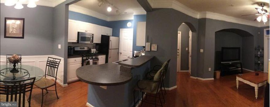 Best Priced Condo in development! Completely upgraded condo in the exclusive gated community of Startford Club. Upgraded appliances, hardwood floors throughout, custom paint, upgraded fixtures and much more.  Move in condition.