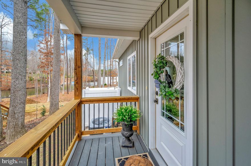 This waterfront rambler features 2 bedrooms and 2 full bathrooms.  This home was completely re- done , everything is brand new including the trusses.  New roof, HVAC , drywall, bathrooms, kitchen .  Everything remodeled in 2021. The family room includes a cozy gas fireplace, and sliding glass doors lead to a three-level deck with a gazebo. Looking out through the double sliding glass doors you will see a picturesque water view.  Wrap- around trek deck  right off kitchen area.  Granite counters with stainless steel appliances.  Also shaker cabinets.  Large bedrooms .  Walk way down to fire pit and dock area.  Kayak rack built in.  A new dock was installed in 2021, Additionally, the home has a studio equipped with a mini-split air conditioning system and this would be perfect for guests . Studio also has a deck to enjoy the water view.  Bonus also has an outdoor shower so you can rinse off after your water adventures! Other side has a workshop attached. The property is approved for a 3-bedroom perc test.  Front yard is  landscaped. Crawl space is climate controlled.   Come and see for yourself this breathtaking home and enjoy !