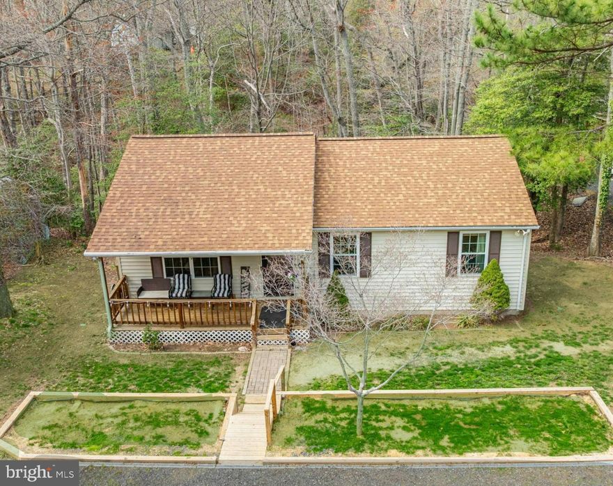 Welcome to 12175 Bonanza trail! This charming 3 bedroom, 2 bathroom rambler sits on a private, wooded lot in the water-oriented Chesapeake Ranch Estates community.  Enjoy peaceful mornings on the covered front porch and evenings on the back deck, overlooking trees. With generous sized bedrooms, hardwood floors, a large eat-in kitchen, a perfect quiet setting, and the added peace of mind  of a new septic &  roof,  this is a great stress-free option for a first  home, a rental investment, or even downsizing to single-level living!