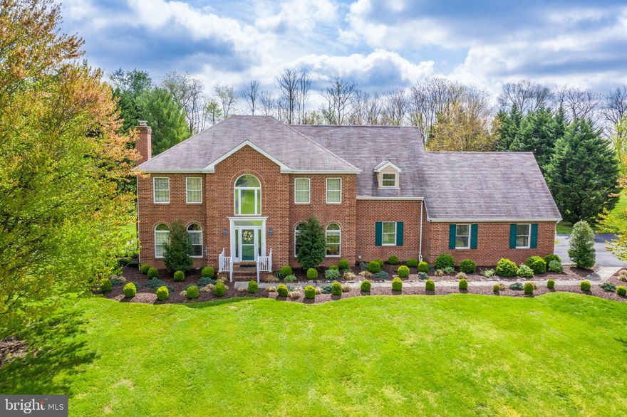 HARD TO FIND, all-brick, two-story, colonial in an established neighborhood.  This BEAUTY is well-sited on a 1.57 acre lot.  Inside the home is upgraded hardwood and laminate flooring; an updated kitchen with stainless steel appliances, double oven, and large pantry; and an open floor plan with flexible spaces to meet any lifestyle.  The master suite is expansive with two dressing rooms, a large master bedroom area, and a huge master bathroom with separate soaking tub and shower.  Two additional bedrooms share a full bathroom upstairs.  On the main floor you will also find an office/library and mudroom/laundry off the garage and kitchen.  The exterior features a large attached deck, a master bedroom balcony, an in-ground firepit, and a storage shed.   Unfinished basement with bilco door walkup.