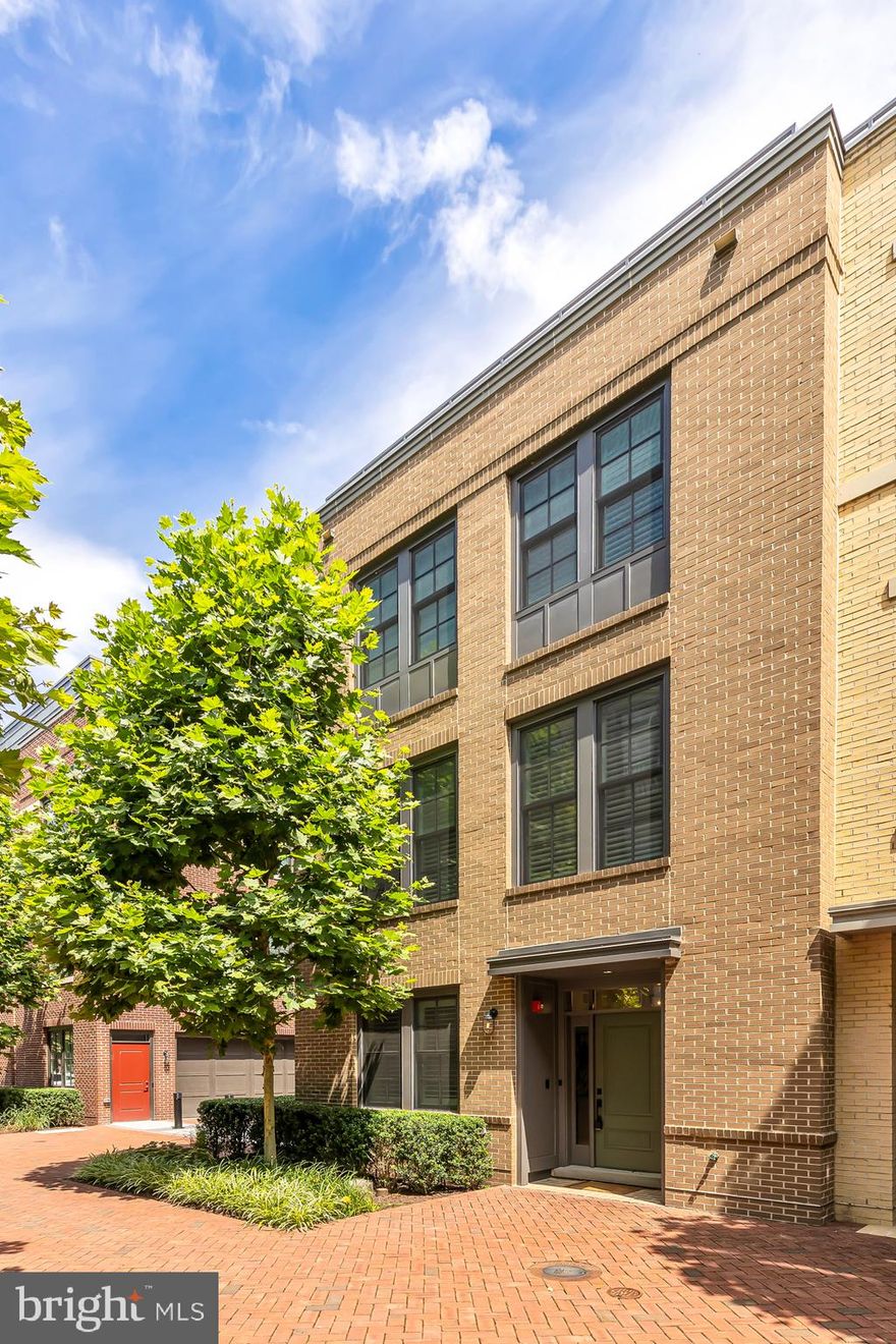 Absolutely stunning Old Town Alexandria row home just steps from the waterfront! This is a rarely available corner unit with over 3,000 sq ft of living space. Contemporary row home living with all the amenities of Robinson Landing.

The main level features an open floor plan, living room with fireplace, dining room, gourmet kitchen with white cabinetry, Silestone countertops, ceramic backsplash, center island and wi-fi enabled stainless steel appliances, and access to a balcony.

The second level is home to the primary suite with a spa-inspired bathroom, sitting area, and two beautiful custom walk-in closets. Plus an additional bedroom, bathroom and large laundry room. The upper level features a family room with access to the roof-top deck with plenty of room for hosting friends or enjoying a quiet cup of coffee. This level is complete with the 3rd bedroom and bathroom. Other highlights include hardwood floors, sophisticated modern finishes, main level office/4th bedroom, a 2-car garage and an elevator with access to all four levels. 

The award-winning, waterfront community of Robinson Landing offers the best of Old Town living. The owner's lounge, library, meeting room, gym and yoga studio all have amazing water views. The same building houses the concierge desk, pet spa and bike storage/workshop. Dine in the waterfront restaurants and stroll along the boardwalk!
