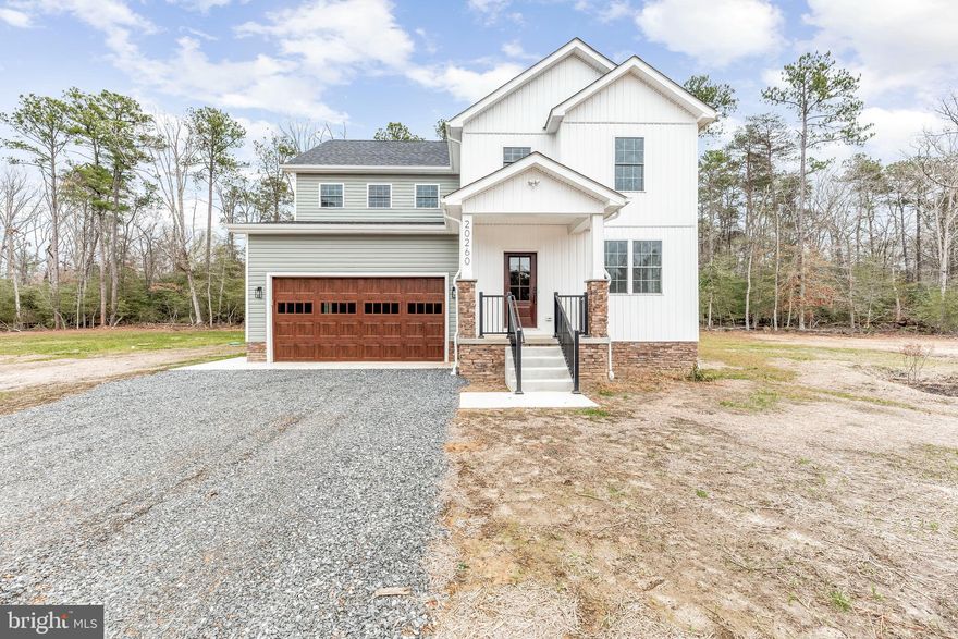 IMMEDIATE DELIVERY! Welcome to 20260 Hawks Way, a stunning immediate delivery brand new construction home situated on 1.34 flat acres in rural Leonardtown. This 4-bedroom, 2.5-bath residence showcases a modern design with thoughtful details and high-end finishes throughout.

The main level features luxury vinyl plank flooring and a bright, open-concept layout perfect for both everyday living and entertaining. The gourmet kitchen is the heart of the home, boasting quartz countertops, stainless steel appliances, and stunning two-tone shaker cabinetry that combines warmth and sophistication. A spacious center island offers additional prep space and seating, all overlooking the expansive living and dining areas.

Upstairs, the oversized primary suite offers a peaceful retreat with a generous walk-in closet and a spa-like en-suite bath featuring dual vanities, a custom tile shower, and sleek black fixtures. Two additional bedrooms, a full bath, and a convenient laundry room complete the upper level.

With a two-car garage, no HOA, and a private, wooded setting just minutes from Leonardtown’s charming town square, waterfront attractions, shops, and restaurants, this home offers the best of Southern Maryland living.

Don’t miss the opportunity to make this stunning new home your own.