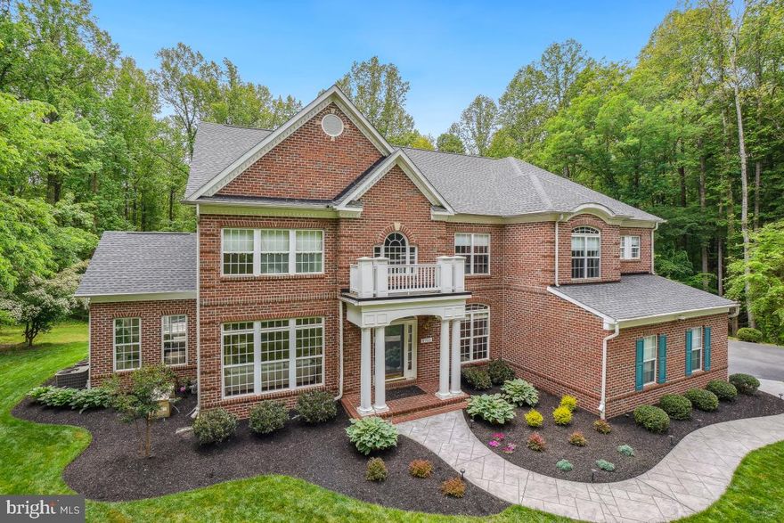 WELCOME to 6703 Green Moss Drive – YOUR DREAM HOME AWAITS!

Discover everything you've been searching for in this extraordinary residence, located in the prestigious gated community of Avalon, where luxury meets privacy on nearly 4 acres of wooded serenity.
This stunning 4–5 bedroom, 4.5-bath estate offers over 7,000+ square feet of beautifully designed living space across three finished levels — an exceptional blend of elegance, comfort, and functionality perfect for families and entertaining.
As you approach via a LONG PRIVATE DRIVEWAY, you'll be captivated by the grandeur of this impressive home. Ample parking is available with a 3-car garage & expanded parking area for guests.
Inside, you'll find soaring ceilings, an abundance of natural light, and thoughtful architectural details throughout. Highlights include:
• Two-story foyer with both FRONT and REAR staircases
• Elegant formal living and dining rooms
• Spacious sunroom and home office
• Dramatic two-story family room with floor-to-ceiling windows and a stunning 2-story
stone fireplace
• A TRUE Chef’s kitchen featuring granite countertops, stainless steel appliances 
(including double wall ovens), wine cooler, large center island, and extensive 
cabinetry
• ELEVATOR access to all three levels, ideal for multi-generational living
• Whole house Generator, for peace of mind.
The fully finished lower level includes a 2ND full kitchen, home theater, gym, office, 
a full bathroom, and a versatile 5TH bedroom or den.
Step outside and enjoy your own private retreat complete with a spacious patio and HEATED 
POOL, ready for endless entertaining and all surrounded by beautifully landscaped grounds 
– it’s the outdoor oasis of your dreams. 
Ideally located near Andrews Air Force Base and with easy access to Washington, DC, 
this is truly a rare offering.