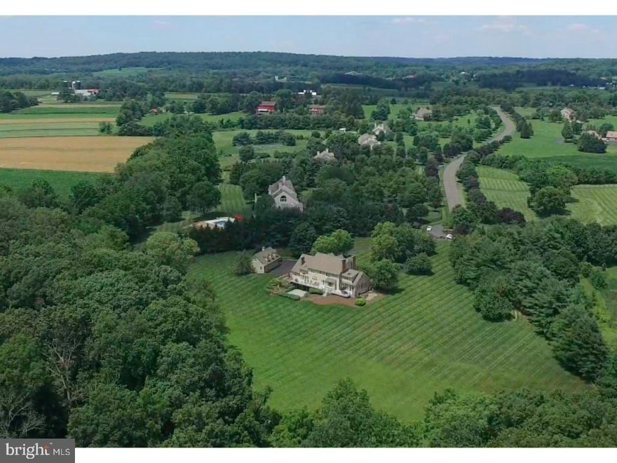 Peace and tranquility, awaits you as you drive up to 760 Tower View! The tree lined governor's drive welcomes you into the perfect country setting. This home was designed and custom-built By Jane Toll. This center hall colonial features a two-story foyer flanked by a formal living room with wood burning fireplace and formal dining room. The living room opens to a beautiful great room featuring a fireplace surrounded by authentic Mercer tiles. This room leads into the grand conservatory with exposed brick flooring and floor to ceiling windows. The kitchen, great room and conservatory all have access to the full-length composite deck which makes this home an entertainers dream. This home features 4/5 BR including a fabulous first floor Master and 5 1/2 baths. The chef's gourmet kitchen with cherry cabinetry offers high-end stainless steel appliances, soapstone countertops, wine refrigerator, island and a two-story breakfast area with a magnificent wood burning fireplace which is the perfect touch for elegant dining. The second floor boasts an additional master suite with fireplace, den and sumptuous master bath,  princess suite, BR #3, Br #4/Office and hall bath. Third floor access which can be converted into additional living space. The three-car detached garage features a second floor with separate entrance. This is a perfect area for a home office, gym, au pair suite, your options are endless.