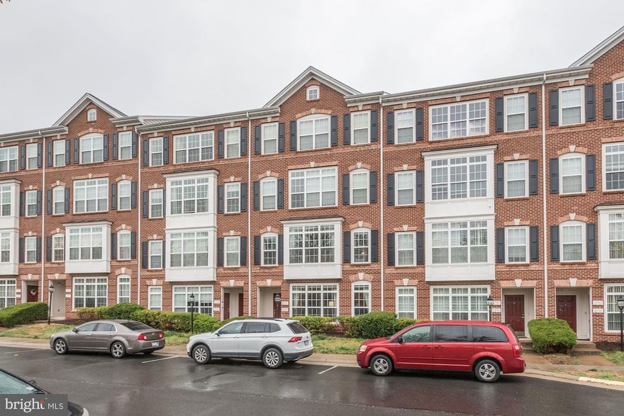 Hurry this home won't last long!Gorgeous brick front condominium with rear loading single garage allows for beautiful curb appeal.  When entering main level you will find all updated Bamboo hardwood floors, upgraded kitchen and all stainless steel appliances.  Upstairs large Master Bedroom walk in closet, Master Bath Soaking Tub & Separate Shower.  Second Bedroom walk out balcony. Convenient to Brambleton Town Center and all Brambleton has to offer. Brambleton features 4 Pools, 18 Parks, Basketball, Tennis & Volleyball Courts and much more.