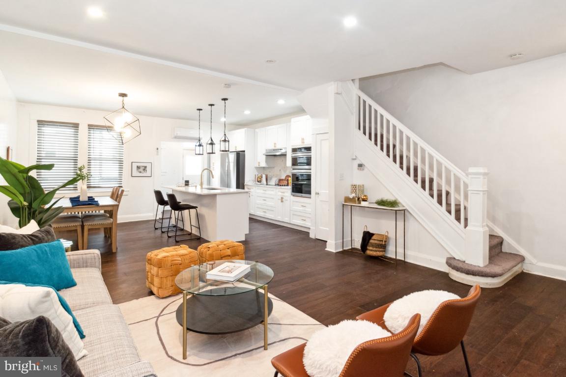 Welcome to this beautifully renovated townhome in the heart of Belair-Edison Neighborhood of Baltimore, where you'll enjoy easy access to local parks, dining, shopping, and major commute routes.
The home seamlessly blends modern style with thoughtful design, offering a fresh and inviting space, perfect for comfort living. As you step into the main level, you'll be greeted by an open-concept floor plan featuring ample living and dining space, perfect for entertaining and relaxing. The gourmet kitchen is a showstopper, complete with a central island with quartz countertops, soft close new shaker cabinets, and brand-new stainless-steel appliances that make cooking a joy. The upper level boasts three spacious bedrooms with brand new carpet and a full renovated bathroom. The fully finished basement provides a versatile living quarters with its own private entrance, perfect for guests, in laws, or rental potential. It features a 4th bedroom, a full bathroom, and a separate laundry room for added convenience. Step outside to your fully fenced private back patio, an ideal space for outdoor gatherings. Additional features include new roof, tankless water heater, and Cooper & Hunter AC and Heat wall units in every room for year-round comfort. Don't miss this opportunity to own a move-in ready affordable home. Schedule a showing today!