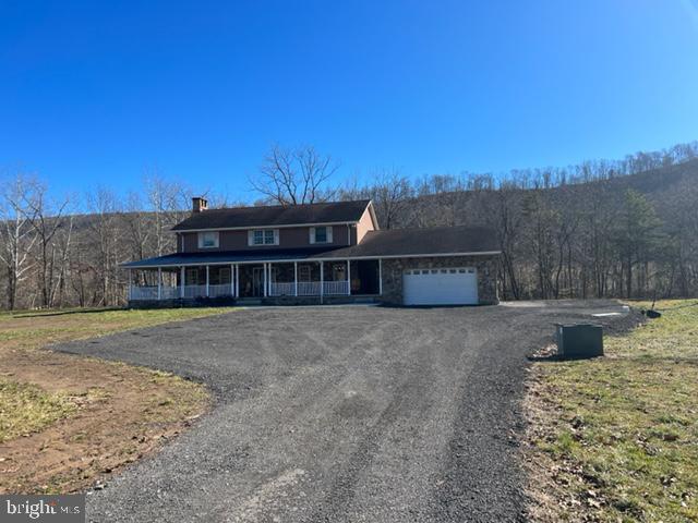 Nestled up in the hills of northern Allegany County is this charming custom country home on over 63 acres of western Maryland beauty in Ellerslie. This property is being sold "AS IS", and is the perfect opportunity for a buyer to purchase the property and run in whatever direction their heart desires. The home was built in 1996 and was a complete custom build with over 5,000 total sq. ft. including the basement. The house is fully furnished with everything being negotiable with the sale of the property. Included with the sale of the property is one large 50'x100' steel insulated building, one barn with 6 stables, water, and electric, horse riding ring, and plenty of fencing for your animals. There is also a tenant house on the property currently being fixed up that could be used as rental income, storage, or whatever you decide. Enjoy some fishing in the 4 acre pond that sits behind the house, or enjoy Wills Creek that runs along the easterly boundary of the property. If you prefer a little luxury, relax by the inground pool, and enjoy the ammenities of the full kitchen and bathroom in the pool house and outdoor bar. This property boasts so much opportunity including the approximate 10 acres of pasture that can be used livestock or converted back to farmland. There are several pieces of equipment on the property, 4-wheelers, ATV's, and farm equipment that can be negotiated in the sale. Enjoy great hunting right in your backyard, as several deer where seen, while a nice flock of turkeys call it home. Enjoy the peace and quiet all while being 15 minutes from Cumberland, MD, Pennsylvania, and interstate 68. This is a one-of-a-kind property for the area, nothing like it, and with a little TLC, you will have a gem up in the mountains. SELLER FINANCING AVAILABLE, inquire for details.