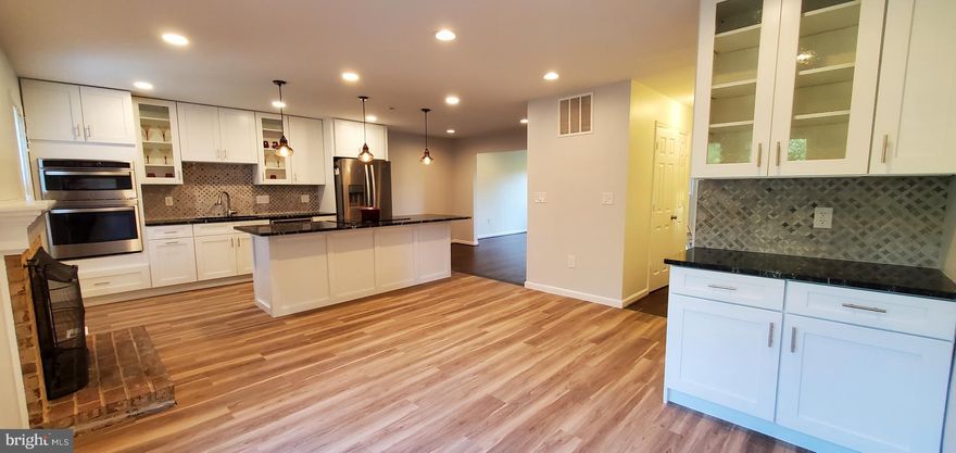 Move right in and live in the heart of the Town of Vienna with its plethora of shopping and dining opportunities, well regarded schools and wonderful community events!  Tucked away in a small, private enclave of homes just off of Vienna's charming "Church Street," 417 Council Dr. NE is a town home that "feels" and lives like a single family home!

This spacious home has just been thoughtfully remodeled with attention to today's style preferences.  Newly refinished warm, wood floors are the foundation of the living room and dining area.  The BRAND NEW EAT-IN KITCHEN is the heart of the house and is an entertainer's DREAM!   White Shaker-Style cabinets, a 9 foot wide island with breakfast bar, stainless steel appliances, down-draft cook-top, granite counters, contemporary tile backsplash, walk-in pantry, bar/butler's pantry, recessed and pendant lighting, easy-care vinyl plank flooring and a cozy gas fireplace are just a few features of this wonderful space!  French doors invite natural light to stream in and provide a lovely view of the back yard.  Three ample sized bedrooms, two full bathrooms and a large linen closet provide maximum privacy on the  upper level.  The primary suite includes a walk-in closet and a chic full bathroom with double sinks and a tub/shower combination.  New blonde wood floors are elegant and minimize allergies often caused by carpet.  The lower level with it's bright windows and walk-out to the back yard is home to the large fourth bedroom.  If not needed as a dedicated bedroom, it would perfectly serve as a combination home office and part of a private visitor suite (when needed).  The fourth bedroom is next to the third full bathroom with it's easy access step in spa shower.   Relax  in the recreation room to watch a movie or sporting event on a television over the second gas fireplace.   The recreation room is well equipped with a wet bar and small bar fridge.  A full size washer and dryer are also housed on the lower level.  Walk out to the fully fenced back yard.  Use of a gas grill and patio furniture included in the rent will be the site for so many fun barbeques!  

Parking is assured in your two reserved parking spaces.  Your guests will be able to park in one of the 10 visitor spaces directly across from your home or on the street (that is one house away).  

Vienna is home to absolutely any and every service you will need in addition to a ton of shops and restaurants!  What international cuisine are you in the mood for today - Greek, Turkish, Japanese, Thai, Chinese, Mexican, Persian, Italian, Middle Eastern, etc.?  Great restaurants including continental fine dining, diners and fast food are all within a few blocks!  If that's not enough shopping and dining for you, one of our nation's premiere shopping malls and entertainment centers, Tysons Corner, its' high-end sibling, The Galleria and the brand new theater and concert venue, Capital One Hall are respectively 2 and 3 miles up the the street ! 

If you have to commute, you'll absolutely LOVE this location!  A Fairfax County Connector commuter bus stop is a 1/2 block from your front door.  The bus travels to the Spring Hill Metro Station (2 miles away).  Metro whisks you to the Pentagon, Arlington and Washington, DC.  The huge employment hub of Tysons is the next city.  Northern Virginia's high tech corridor including Reston, Herndon and Ashburn are very close!  Washington Dulles International Airport is an easy drive!  Easy access to 66, 495 and the Dulles Greenway!

Prepare to stay!  You won't want to leave!

We look forward to your visit!  Welcome home!