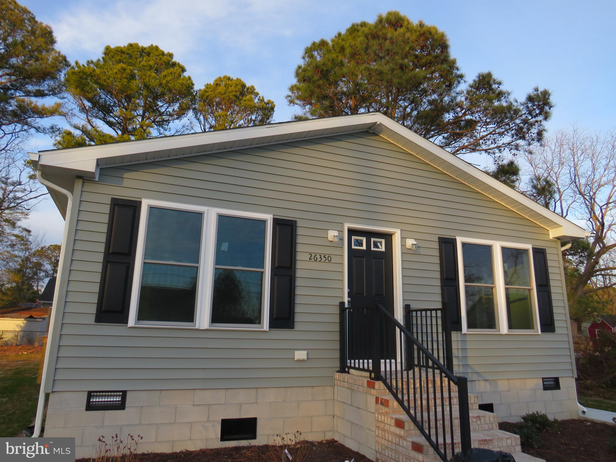 New construction just outside city limits! Check out this newly built home on lot located conveniently just outside of town, but just a quick walk to amenities. Open floor plan with large living room, dining area off kitchen, large utility room with washer and dryer and outside entrance. Three bedrooms and two full baths including a primary bedroom and bathroom suite. Wide hallway would easily accommodate a wheelchair. Walls are 6" for energy efficiency, all energy efficient appliances and heat pump. Call today for a showing!