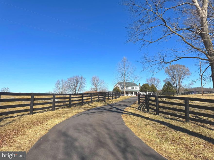 This beautiful white farmhouse with green trim has been extensively upgraded since 2016. Set 100 yards from Pierce Road, down a curved asphalt driveway (2024), the house and yard are enclosed by 3,300+ linear feet of new four-board fencing (2021). A wide entry walk leads visitors between two holly trees to a red-trimmed glass front door. The three-sided wrap-around porch features sustainably harvested Brazilian hardwood (Ipe). A spacious covered back deck (10' x 40') provides ample space for outdoor dining and socializing. A circular raised concrete patio includes a built-in fire ring (2019). Mature trees offer shade, beauty, and space for bird feeders.
The sizable backyard features a 40' x 80' deer-fenced garden with 380 feet of planting space in twelve 4' x 8' raised beds. Trellises maximize vertical growing space. A 10' x 12' garden shed stores tools and supplies. Also, within the fenced yard is a custom-built chicken coop with tack room and exercise yard. Another shed protects the well pump and components.
Major exterior renovations in 2018 included new white Hardie board siding, a green standing seam metal roof, and a brick-clad chimney. All new windows and doors were installed, with a transferable lifetime warranty. New 14 SEER dual-zone heat pumps were installed in 2017. All doors are keyed alike, and additional entrances access the mudroom/laundry room and a large bonus room, potentially a first-floor master suite. Dimmable recessed lighting enhances the covered porch.
Interior upgrades include scratch-resistant laminate floors covering 2,400 sq. ft. of main living areas, with waterproof vinyl in the bathrooms and kitchen. All baseboards were replaced. Upstairs baths were updated with new showers, tubs, granite vanities, and Toto toilets (2024). The downstairs powder room received a new vanity and Toto toilet (2021). The laundry room features a deep utility sink and cabinets with counter space.
The 15' x 20' dream kitchen (2023) boasts stainless steel appliances, KraftMaid maple cabinets in a warm praline finish, and engineered quartz countertops. Upper cabinets extend to the ceiling, while a lower corner cabinet includes super-Susan rotating shelves. A custom-built baker’s cart provides additional counter space and neatly rolls under a countertop. The kitchen has two full-height pantry cabinets—one in the kitchen (42" wide) and another in the adjacent library (36" wide). Appliances include a Frigidaire professional induction cooktop, GE Café series double wall ovens, Café series dishwasher, Frigidaire Gallery full-size refrigerator, and a Frigidaire Gallery full-size deep freezer (-4 degrees) in the nearby laundry room. The countertop microwave is an Amana commercial model. A custom copper backsplash behind the cooktop features a sheaf of grain and bees.
The entire property is fenced for livestock, with a four-board fence around the yard and property frontage, while wire fencing with a top board encloses the back and sides. Pastures can be divided into sections of 22, 9, and 5 acres. The 22-acre section has an automatic waterer, with access for other pastures if gates remain open. A farm gate with a cattle guard allows access for stock trucks and heavy vehicles, keeping them away from the house and driveway. Farm lanes have a blue stone underlayment.
Outbuildings include a 30' x 30' Morton building and two run-in sheds. The Morton building is wired for electricity, piped for water, and divided into a workshop and storage room. Roofs over both sections add storage space. One side has a hangar-style door, and another has a garage door, with floor space for a tractor, mower, and utility vehicle.
All well equipment was raised above ground in a heated shed (2017) with a sump pump. Water is treated with a salt-based softener and ultraviolet purifier. The well shed offers storage for lawn chairs, hoses, and more. The septic system has been routinely maintained.
All sizes approximate. More photos coming soon.