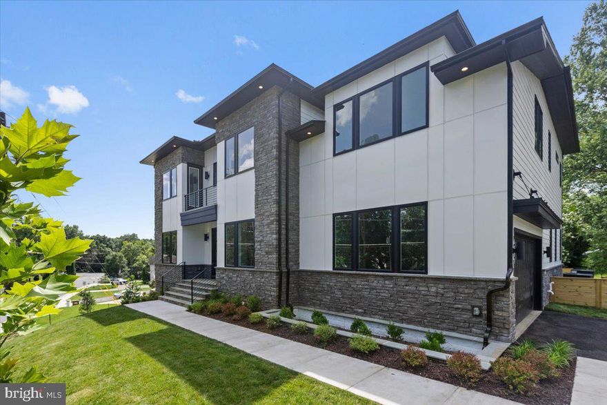 Luxury Living at an Exceptional Value in McLean. This newly built 7-bedroom, 6.5-bath luxury residence offers nearly 7,000 square feet of refined design, craftsmanship, and modern elegance at an outstanding value within the highly sought-after Chesterbrook, Longfellow, and McLean High School pyramid.

Step inside to soaring 10-foot ceilings and a striking foyer that sets a sophisticated tone. The main level is thoughtfully designed for both daily living and entertaining, featuring a private office, formal dining room, and a showpiece chef’s kitchen with premium Dacor appliances, waterfall-edge quartz countertops, and a spacious walk-in pantry.

The open living area is anchored by a sleek gas fireplace, recessed lighting, and wide-plank oak hardwood floors, creating a warm, inviting atmosphere. A main-level bedroom suite offers ideal flexibility for guests, in-laws, or multi-generational living. Outdoor access leads to a deck overlooking a professionally landscaped yard, perfect for relaxing or entertaining.

Upstairs, the owner’s suite provides a true retreat with a spa-inspired bath, freestanding soaking tub, zero-entry shower, dual vanities, and a custom walk-in closet with built-ins and glass display cabinetry. Four additional en-suite bedrooms and a conveniently located laundry room complete the level.

The finished walkout lower level is designed for both entertaining and extended stays, featuring a wet bar, media room, exercise space, and an additional bedroom with full bath.

Located moments from shopping, dining, and commuter routes, this home delivers luxury, space, and thoughtful design at a compelling value rarely found in McLean.

Schedule your private tour and experience the opportunity for yourself.