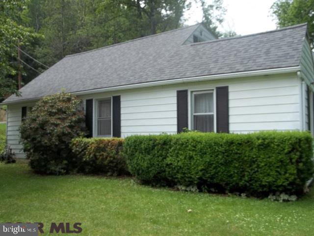 Quiet location on dead end street, double lot on 1.03 acre, home has many possibilities, close to town but private setting.