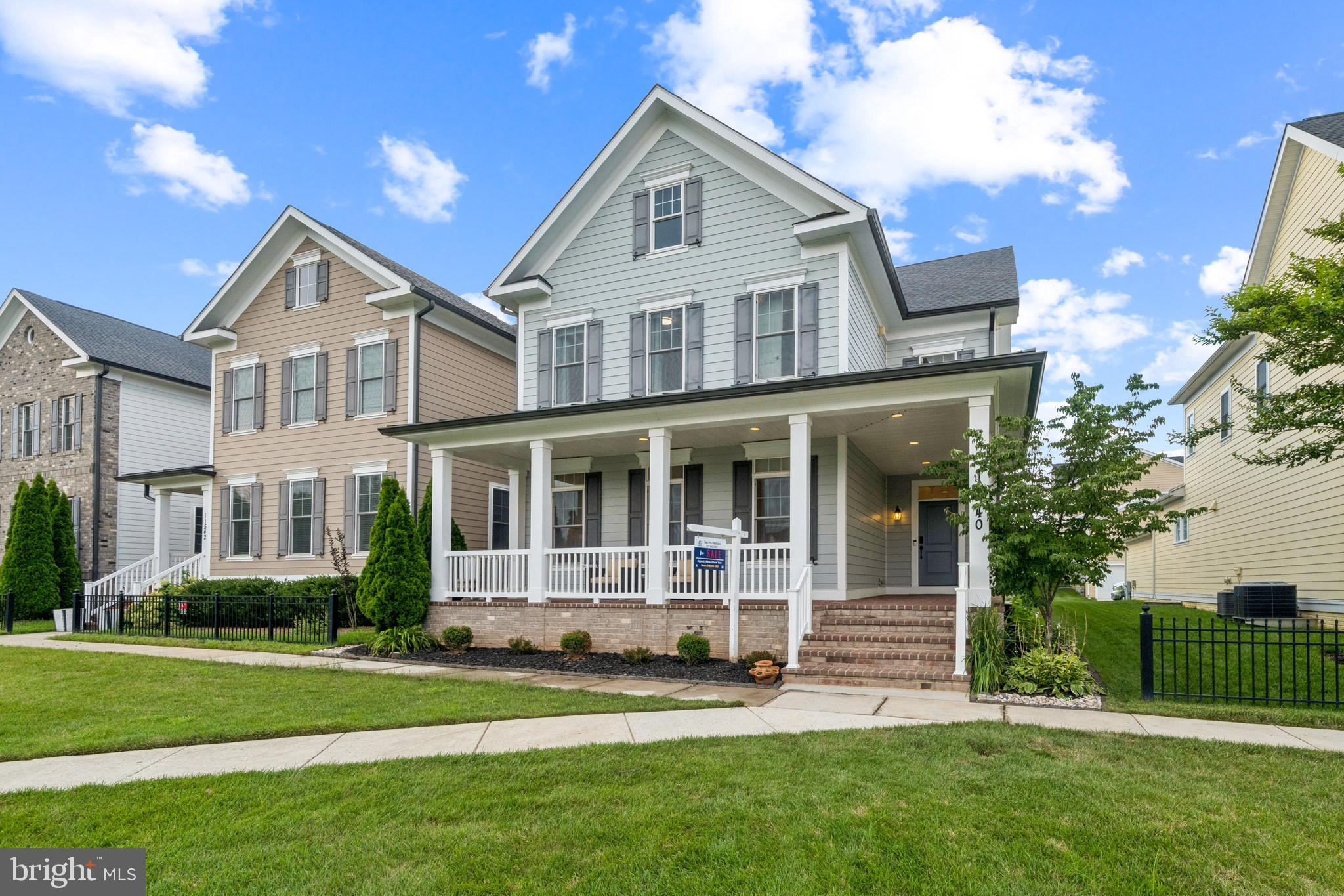 Welcome to 11540 Iager Blvd, a stunning Bozzuto Sage model located in the heart of Maple Lawn’s highly desirable Garden District. Built in 2017, this energy-efficient home offers over 5,000 sq ft of beautifully finished living space, featuring 5 bedrooms, 5.5 bathrooms, and smart green upgrades including geothermal HVAC, pre-wired solar, and an EV charger. The open-concept layout showcases a chef’s dream kitchen with quartz & Slate countertops, a large center island, a 5-burner cooktop, ample cabinet space, and stainless steel appliances, all flowing into a spacious living area with full-wall sliders that open to a private deck—ideal for relaxing or entertaining. You'll love the wide engineered hardwood floors, the sun-filled loft with a full bath, and the fully finished basement with a huge rec room, guest room, full bath, and a large walk-in closet for seasonal storage. The main-level study/bedroom is perfect for guests or a home office, and each upper-level bedroom has its own private bath. The primary suite is a true retreat with dual walk-in closets, a freestanding tub, and a spa-like shower. With a charming front porch overlooking green space, plenty of guest parking, and access to Maple Lawn’s incredible amenities, this home is the perfect blend of luxury, efficiency, and community living. *** The reported finished square footage is derived from the property’s appraisal report