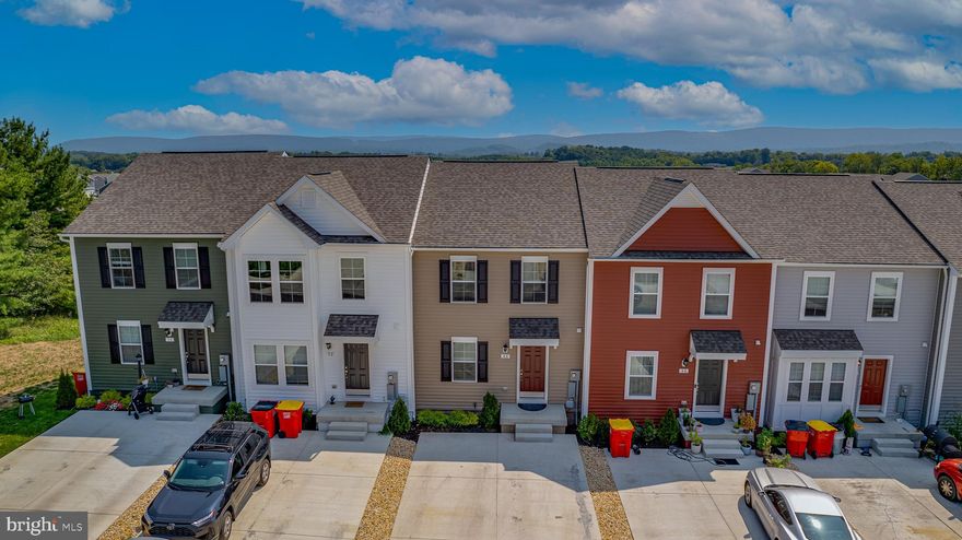 Discover your dream home in Jefferson County with this newly constructed 2023 Colonial Townhome, offering stunning views of the Blue Ridge Mountains. Located in historic Charles Town, WV, you'll be just minutes away from shopping, restaurants, schools, and the local casino. Embrace the vibrant Townes at Tate Manor community, with Jefferson Memorial Park and the charming town just a short walk away. Its prime location near the MD and VA lines makes it perfect for commuters, blending the tranquility of a scenic retreat with easy access to neighboring states.

This home combines the ease of first-floor living with the expansive space of a three-story design. The first floor features a contemporary kitchen with stylish finishes, seamlessly connected to a generous living room—perfect for both relaxing and entertaining. Upstairs, retreat to the owner's suite, where you'll find a spacious walk-in closet and a luxurious, spa-like bathroom. Two additional bedrooms at the front of the home offer privacy and comfort for family or guests. The fully finished basement provides a versatile bonus room, ready to be customized to your needs—whether it's a home office, gym, or entertainment area.

Forget about yard work, as the HOA covers lawn maintenance, giving you more time to enjoy the picturesque surroundings. With a driveway accommodating up to four cars, parking is always hassle-free. To complete the package, a brand-new, spacious patio awaits, the perfect spot to unwind and take in the breathtaking mountain views. Don’t miss the chance to make this 2023 Colonial Townhome your personal haven in Jefferson County.

The house is available for showings and will be move-in ready by October 15th, with the possibility of an earlier move-in if needed.  Please review the Application Process & Qualification Standards in document section.