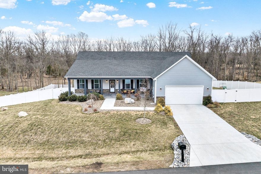 Beautiful Turn-Key Upgraded Ranch Home with  Saltwater Heated Pool. Luxury Features and Fully Finished Walk-Out Basement! Welcome to this beautiful 4272 ft.² upgraded main level living home, offering a perfect blend of modern amenities and elegant design, nestled in a peaceful, wooded setting. The large front porch adorned with lighted cedar-clad ceilings and newly added flagstone greets you into this stunning home.  The two car garage offers two convenient electric chargers for electric vehicles. and a half bath is also located just off the garage entrance  . The expansive family room boasts soaring ceilings with a stunning height of approximately 20 feet, offering an airy and open feel. Brand new custom hand crafted board and batten throughout the main level, built-ins as you enter to the left for your coats and belongings, beautiful built-in bookshelves and entertainment center with shiplap backing crown molding and power outlets. Off the kitchen you’ll find a  built in china cabinet with beverage  bar. The gourmet kitchen is a chef's dream, complete with upgraded soft close cabinets, an extended island wrapped with custom shiplap, top-of-the-line appliances, with quartz countertops and updated gas cooktop. Newly added vent hood  and gorgeous ceramic backsplash along with a newly added  wine pantry and wine fridge. The space flows effortlessly into a sunroom featuring a cozy gas fireplace, perfect for entertaining or enjoying quiet time. Step out onto the spacious 14x20 deck, ideal for family gatherings, or relax on the concrete patio below off the finished basement. The master suite is a true retreat, featuring a boxed ceiling,  a spacious walk-in closet  with custom built- ins for organization. The luxurious master spa bath offers gorgeous tile work and a dual-head, walk-in shower, with freestanding soaking  tub – the perfect place to unwind.  Two additional spacious bedrooms with large walk in closets connected by a beautiful Jack and Jill bathroom featuring large soaking tub and shower combo with tile to the ceiling.  The finished basement (2,272 Sq Ft) is a true bonus, featuring a wet bar, a movie theater, and potential for a fifth bedroom. LVP flooring throughout the home (with exception to the movie room and basement bedroom)  enhances its modern, chic vibe. Outside, you'll find a 14x28 heated saltwater pool with a hot tub that seats six, surrounded by beautiful flagstone and custom landscaping, offering an oasis-like atmosphere perfect for relaxation or entertaining. Additional features include a detached outbuilding with a metal roof, ideal for additional storage or a workshop,  high quality vinyl privacy fence with custom lighting , additional green giant trees added for  privacy. Perfect location, with easy access to I-81, Route 340, Route 9, and Route 7, this home is perfectly suited for commuters, offering convenience without sacrificing privacy or luxury.