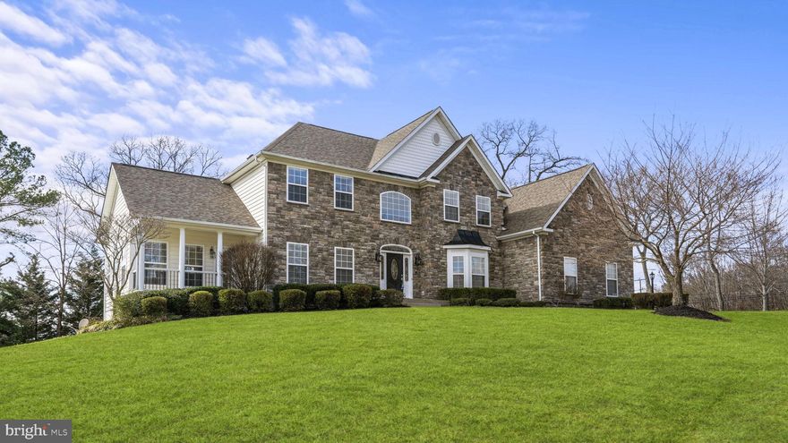 Welcome to your dream home! Enjoy architectural excellence, luxurious spaces, and fine finishes in this former Sona Model home showcasing 6 bedrooms, 5 bathrooms, an Au Pair Suite, and offering over 6,300 square feet of magnificent living space! A traditional floorplan is wedded with an open flow; classic elegance meets entertaining perfection. This custom home boasts extensive millwork, elegant columns, marble 2-story foyer, built-ins, tray ceiling, and rich crown moldings. Moving into the heart of the home, the gourmet kitchen is a Chef lover’s delight boasting granite counters, island with seating, tile floors, upgraded cabinets, tile backsplash, pantry, stainless appliances, double wall oven, and gas cooktop. The attached Morning Room, with walls of windows and natural light, may be used for more casual meals and morning coffee. The open floor plan to the family room is perfect for gatherings, and a separate elegant formal dining room is equipped to host large dinners! Cozy up in the family room during winter evenings and relish the warmth of the gas fireplace. Work from home effortlessly in the beautifully appointed office space complete with built-ins, or retreat to the serene solarium for moments of relaxation and meditation. Ascend to the upper level, where luxury awaits at every turn. The sumptuous owner’s suite beckons with a spacious sitting room or nursery, accompanied by not one or two, but THREE expansive walk-in closets, one of which graciously accommodates a dressing room. Indulge in the attached bath, a haven of relaxation featuring a jetted tub, dual vanity with a dedicated make-up station, separate shower, and private water closet. Completing this level are three additional generously proportioned bedrooms, one with its own attached bath, alongside a convenient hallway bath with a dual vanity. Descend into the lower level, where endless entertainment and comfort beckons. Meticulously crafted to facilitate memorable gatherings and lively celebrations, with the addition of two bedrooms and a full bath, this space seamlessly caters to the needs of both family and guests, ensuring a genuinely welcoming environment for all. Moreover, with the inclusion of an au pair suite and a fully equipped second kitchen, this lower level transcends the ordinary basement experience. Whether it's engaging in friendly competition in the game room (where the presence of a pool table is negotiable), enjoying a spirited card game, indulging in a movie night with your favorites, or getting active in the exercise room, the basement epitomizes an entertainment and versatile living space for all occasions. Step outside to the stamped concrete patio and savor the delights of outdoor living, whether it's lounging in the sun with a good book, hosting a barbecue with friends and family, or simply enjoying the serenity of nature. The side-load 2-car garage, paired with a spacious and elegant stamped concrete driveway, offers ample room for multiple vehicles to park. The irrigation system provides peace of mind your grass will always be green. The home is also equipped with a Generac Generator, ensuring uninterrupted power during unexpected outages. Verizon Fios high-speed internet is at this address too! With every amenity imaginable, this home is truly an elegant sanctuary and entertainer’s dream, all at the same time. Close to downtown Fredericksburg, the VRE, and less than 5 miles to I-95, make it a convenient location to live! Don't miss your chance to experience luxury living at its finest – schedule a showing today!